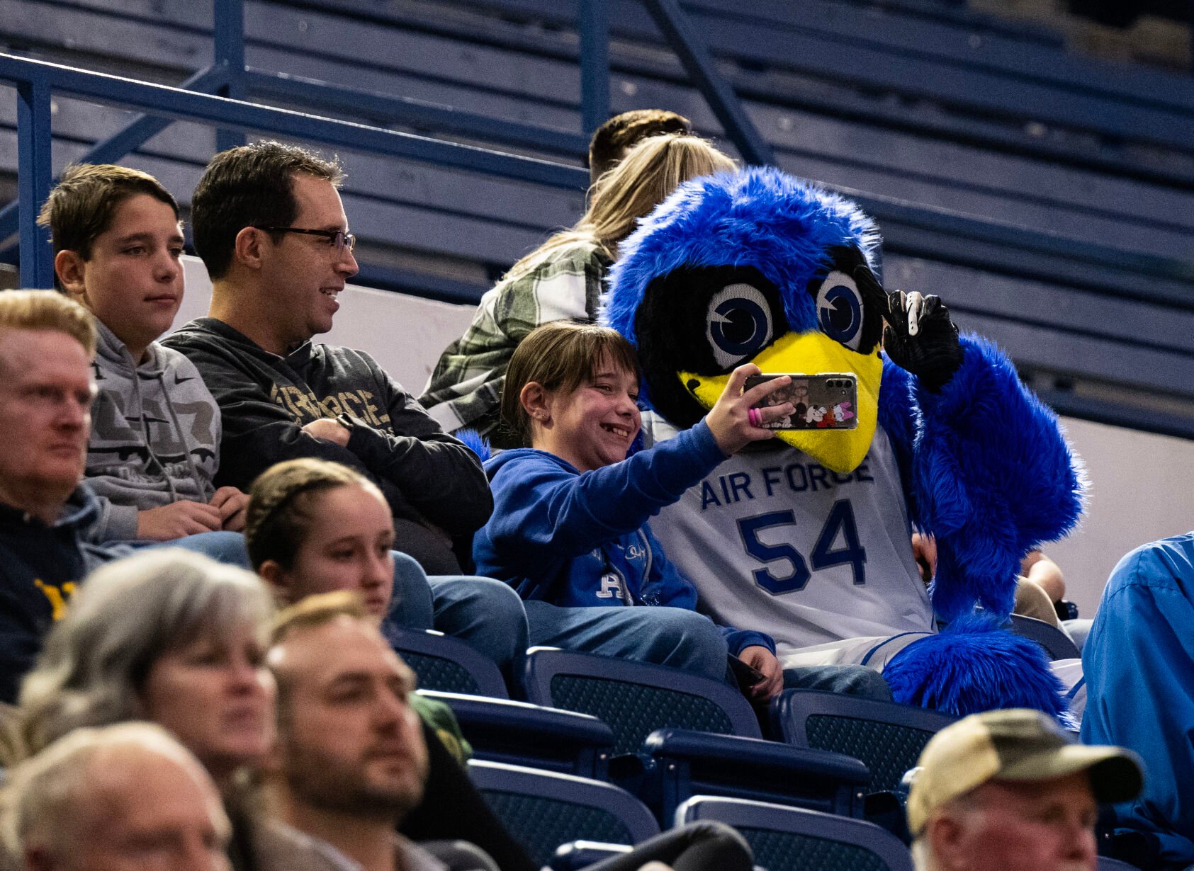 The Bird, the Air Force mascot, takes a selfie with a fan at a women’s basketball game against Colorado State University on Wednesday, Jan. 31, 2024, at Air Force Academy, Colo. (Parker Seibold, The Gazette) (Parker Seibold)
