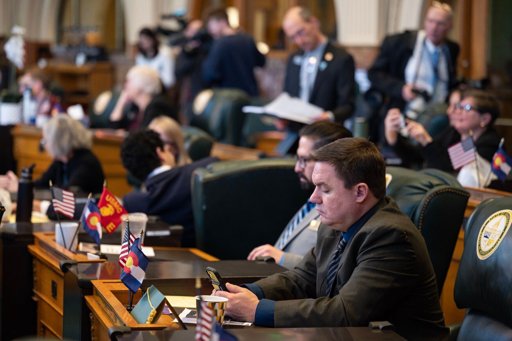 Chad Clifford, who was picked to succeed former state Rep. Ruby Dickson, looks at his phone between votes during the first day of Colorado's 2024 legislative session at the Colorado State Capitol building on Wednesday, Jan. 10, 2024, in Denver, Colo.(Timothy Hurst/Denver Gazette) (TimHursttim.hurst@gazette.comhttps://secure.gravatar.com/avatar/aca82bd62b4ee425c598527cd6faa1b1?d=mm&r=g)