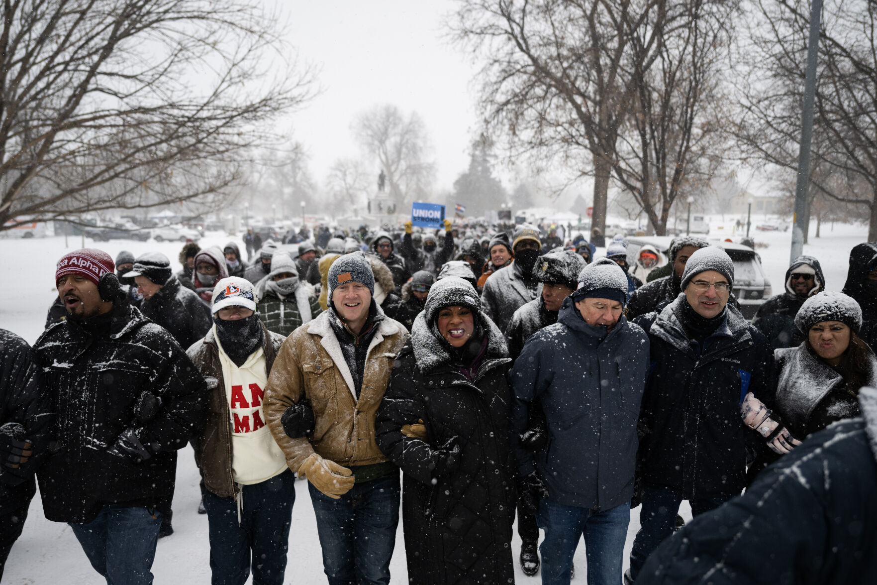 Elected officials, including, from left, Rep. James Coleman, mayor Mike Johnston, Rep. Leslie Herod, Sen. Michael Bennet and Colorado Attorney General Phil Weiser, lead Denver's annual Martin Luther King Jr. Day marade as it makes its way to Colfax Avenue on Monday, Jan. 15, 2024, in Denver, Colo.(Timothy Hurst/Denver Gazette) (TimHursttim.hurst@gazette.comhttps://secure.gravatar.com/avatar/aca82bd62b4ee425c598527cd6faa1b1?d=mm&r=g)