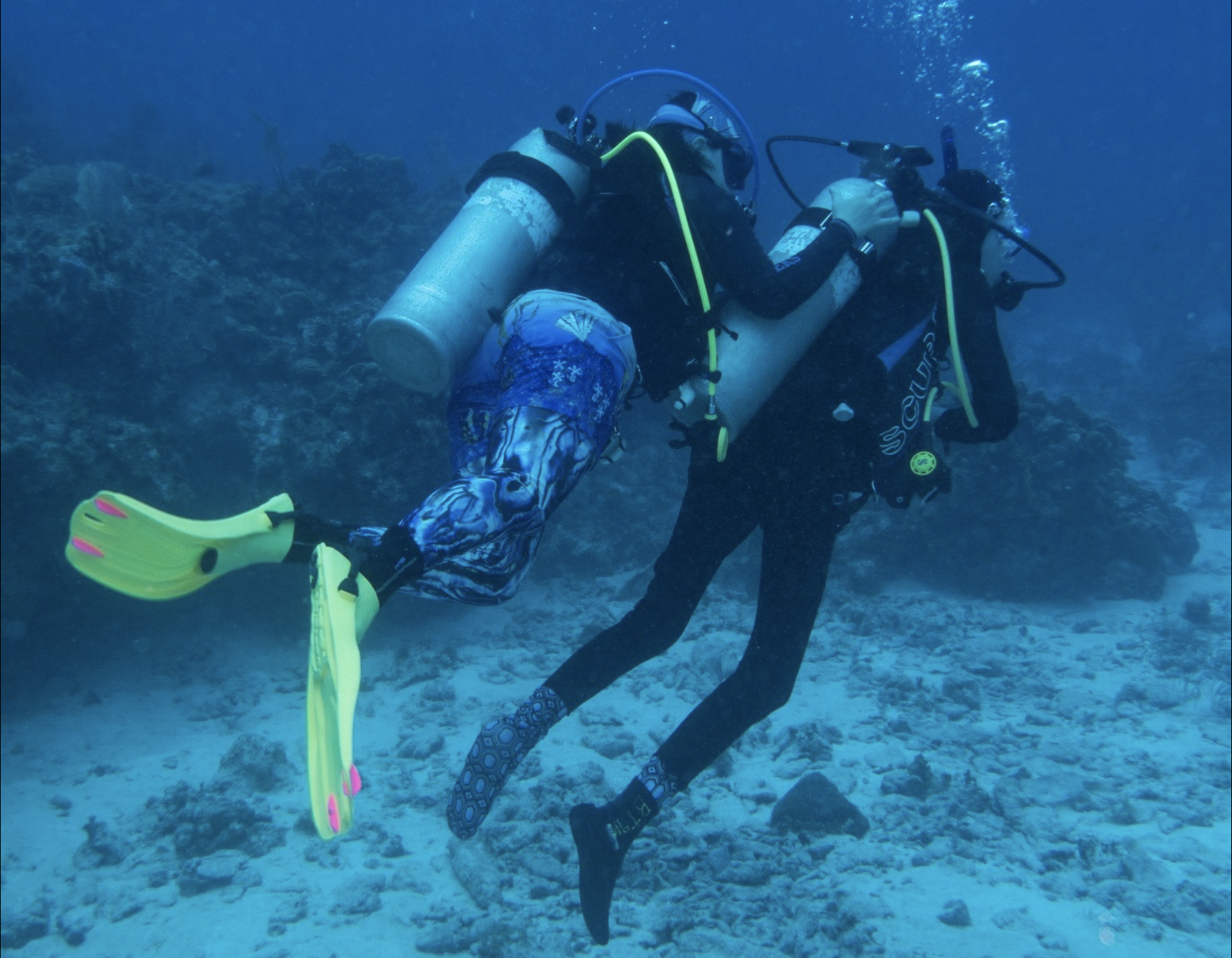 An instructor helps an adaptive diver on a Denver Adaptive Divers trip. (Courtesy photo, Denver Adaptive Divers)