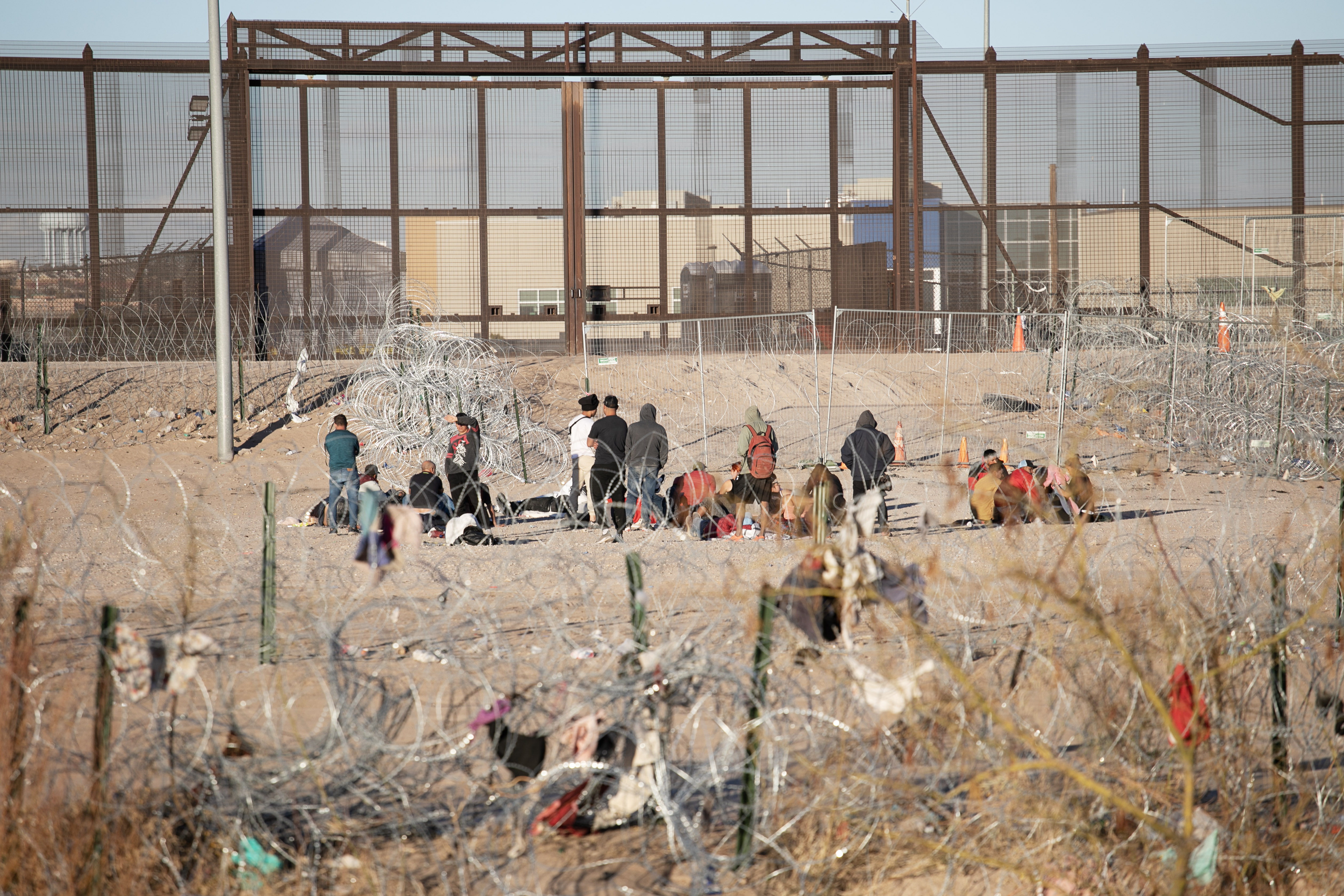 Immigrants hoping to enter the United States wait in a staging area on the northern bank of the Rio Grande river just south of El Paso, Texas on Thursday, Feb. 1, 2024. Most sections of the border wall are built slightly north of the actual border on the U.S. side so Border Patrol and Department of Homeland Security agents can perform maintenance on the structure. (Tom Hellauer, Denver Gazette) (TomHellauerMultimedia Producertom.hellauer@denvergazette.comhttps://denvergazette.com/content/tncms/avatars/f/9e/622/f9e6228a-3b6b-11ed-bf10-fbb71fa8e421.f54b911252c540f1d61709edc4727a39.png)