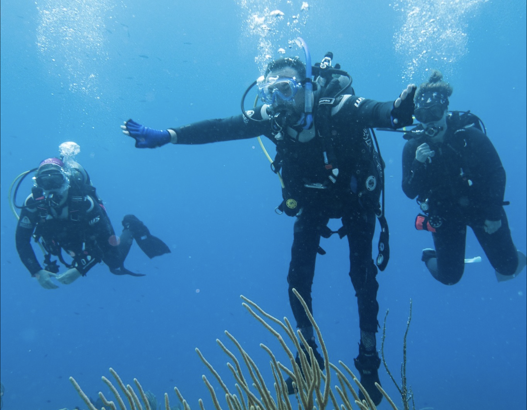 Tyler Wilson, center, an adaptive diver, dives with instructors in tow on a Denver Adaptive Divers trip. (Courtesy photo, Denver Adaptive Divers)