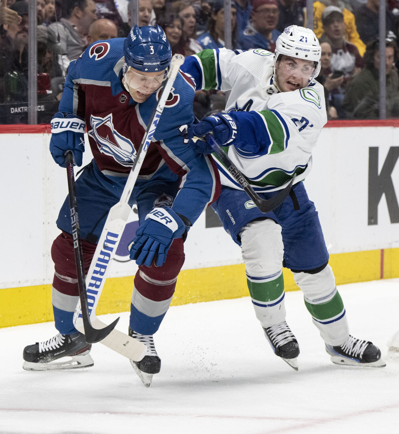 The stick of Colorado Avalanche goaltender Alexandar Georgiev (40)flies between Colorado Avalanche defenseman Jack Johnson (3) and Vancouver Canucks left wing Nils Hoglander (21) during the second period Tuesday, Feb. 20, 2024, at Ball Arena in Denver. (The Gazette, Christian Murdock) (Christian Murdock/The Gazette)