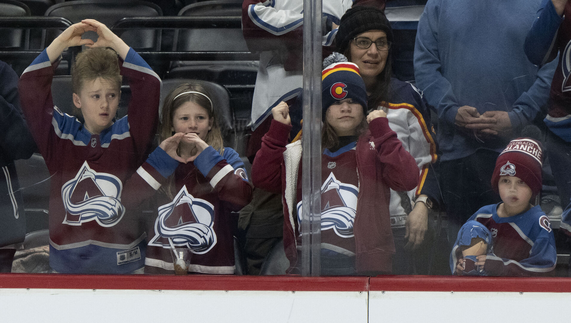 Young fans cheer for their Colorado Avalanche during warm ups before the Avs game against the Vancouver Canucks Tuesday, Feb. 20, 2024, at Ball Arena in Denver. (The Gazette, Christian Murdock) (Christian Murdock/The Gazette)
