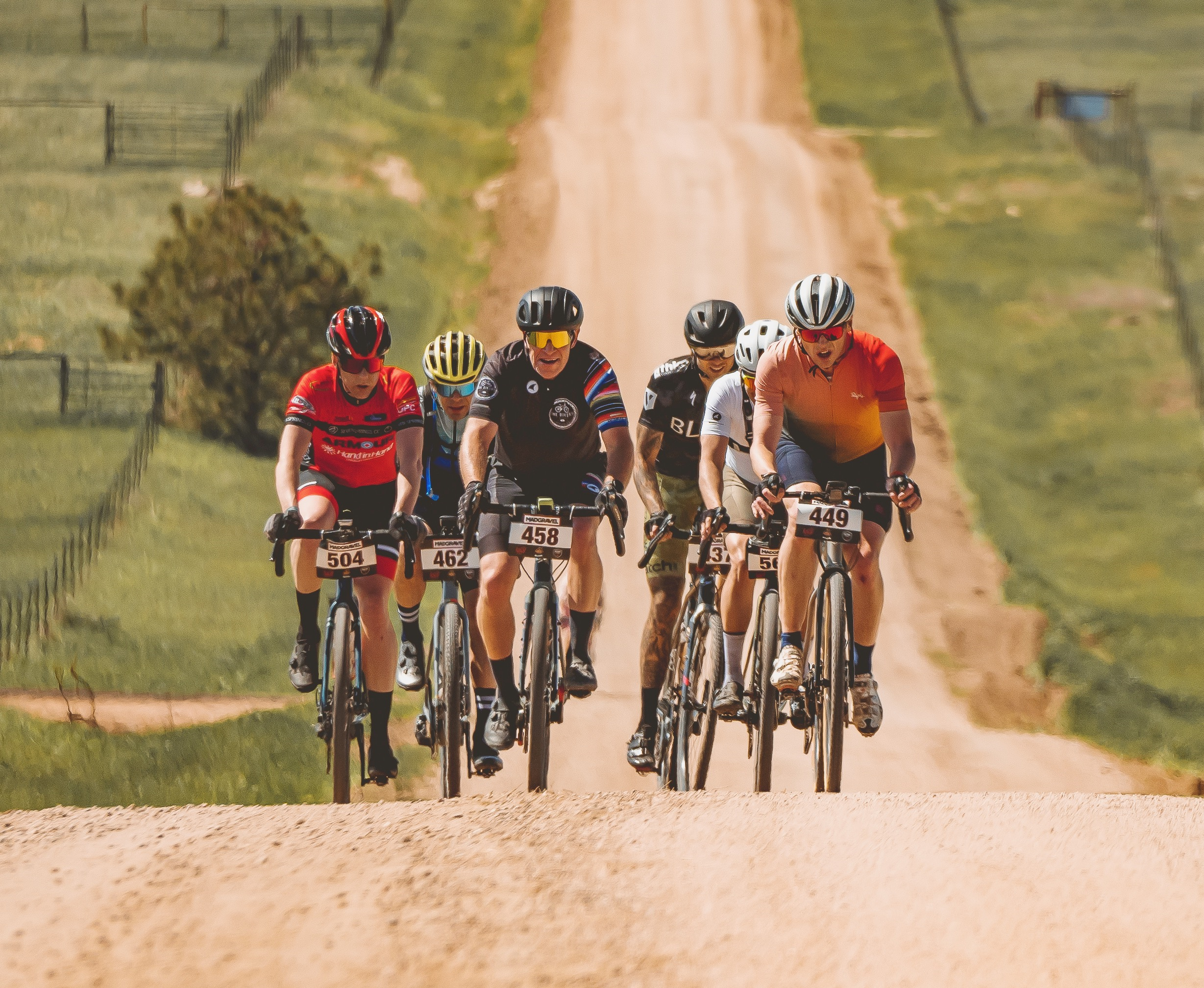 A small gravel bike racer group ascends a county road during the 2023 Mad Gravel event at the McNeil Ranch at Peaceful Valley in Kiowa, Colorado. (Siena Muscianisi)