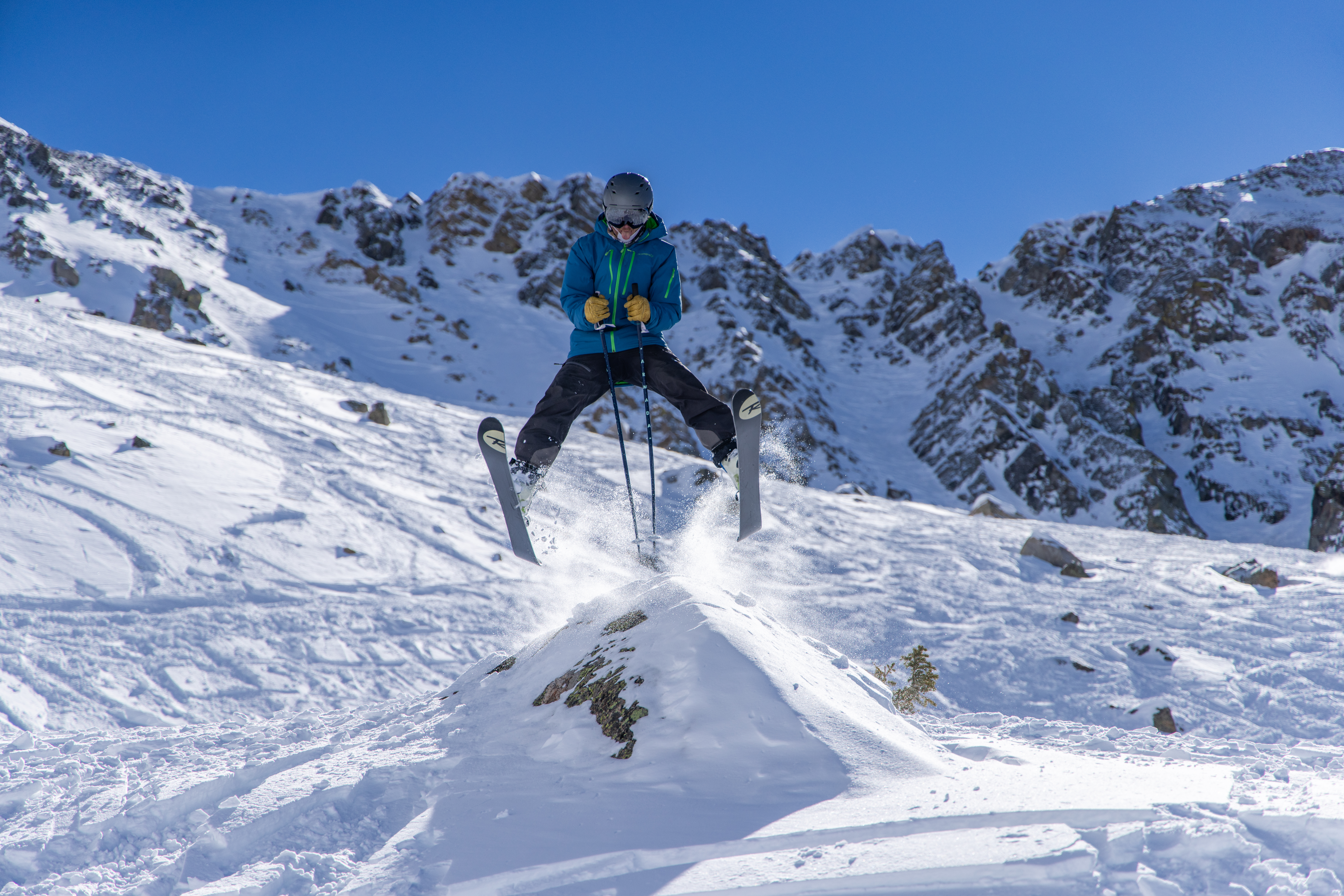 FILE PHOTO: A skier jumps a rock in the Land of Giants terrain below the East Wall Friday, Feb. 17, 2023, at Arapahoe Basin Ski Area in Dillon, Colorado. The East Wall is one of the ski areas most famed terrain zone with a history going back 50 plus years. (Courtesy photo, Arapahoe Basin Ski Area)