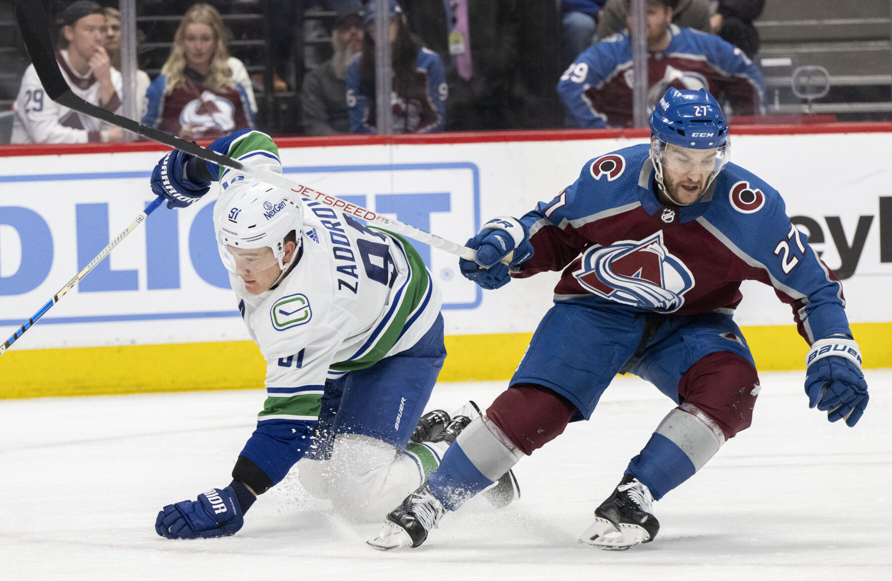 Colorado Avalanche left wing Jonathan Drouin (27) checks Vancouver Canucks defenseman Nikita Zadorov (91) to the ice during the third period Tuesday, Feb. 20, 2024, at Ball Arena in Denver. The Avalanche won 3-1. (The Gazette, Christian Murdock) (Christian Murdock/The Gazette)