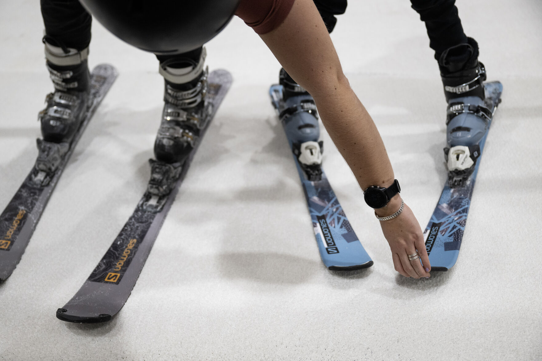 SNÖBAHN training manager and instructor Mary Davis, left, adjusts the angle of first-time skier Quinn Leensvaart, 7, during a lesson on one of the three indoor ski slopes on Wednesday, Jan. 24, 2024, at SNÖBAHN Indoor Ski + Snowboard Center in Centennial. (TimHursttim.hurst@gazette.comhttps://secure.gravatar.com/avatar/aca82bd62b4ee425c598527cd6faa1b1?d=mm&r=g)