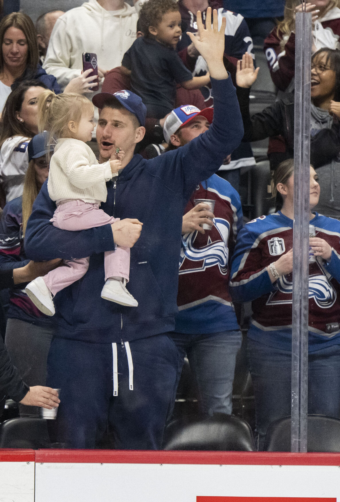 Denver Nuggets center Nikola Jokic celebrates with his daughter after the Avalanche took a 2-1 lead over the Vancouver Canucks during the third period Tuesday, Feb. 20, 2024, at Ball Arena in Denver. The Avalanche won 3-1. (The Gazette, Christian Murdock) (Christian Murdock/The Gazette)
