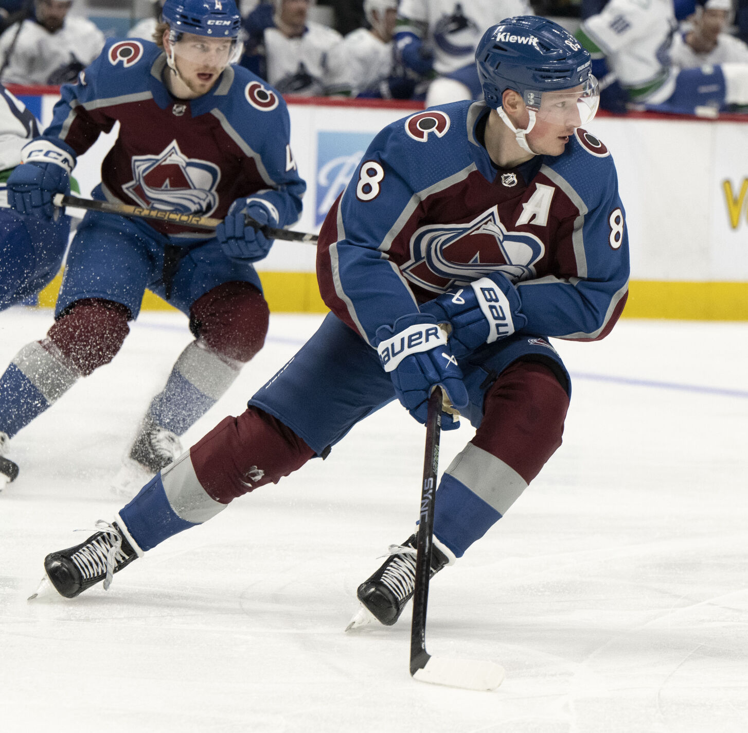 Colorado Avalanche defenseman Cale Makar (8) skates down the ice with the puck during the second period against the Vancouver Canucks Tuesday, Feb. 20, 2024, at Ball Arena in Denver. (The Gazette, Christian Murdock) (Christian Murdock/The Gazette)