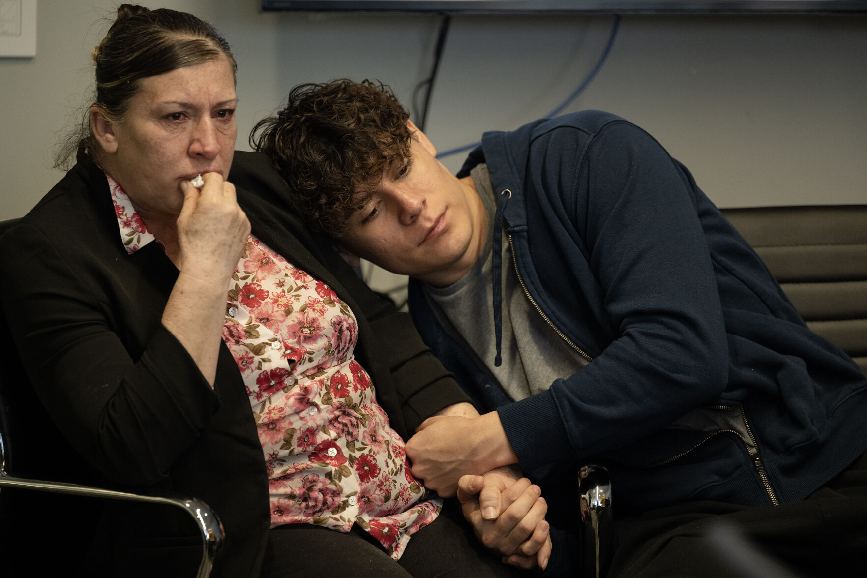 Criselda Bobadilla Sandoval, the mother of Luis Garcia, who was shot on February 13th of 2023 in front of East High School and died two weeks later from his injuries, is comforted by Garcia’s brother Santos Garcia during a press conference at the Barringer Law Firm office on Tuesday, Feb. 13, 2024, in Greenwood Village, Colo. (Timothy Hurst/Denver Gazette) (TimHursttim.hurst@gazette.comhttps://secure.gravatar.com/avatar/aca82bd62b4ee425c598527cd6faa1b1?d=mm&r=g)