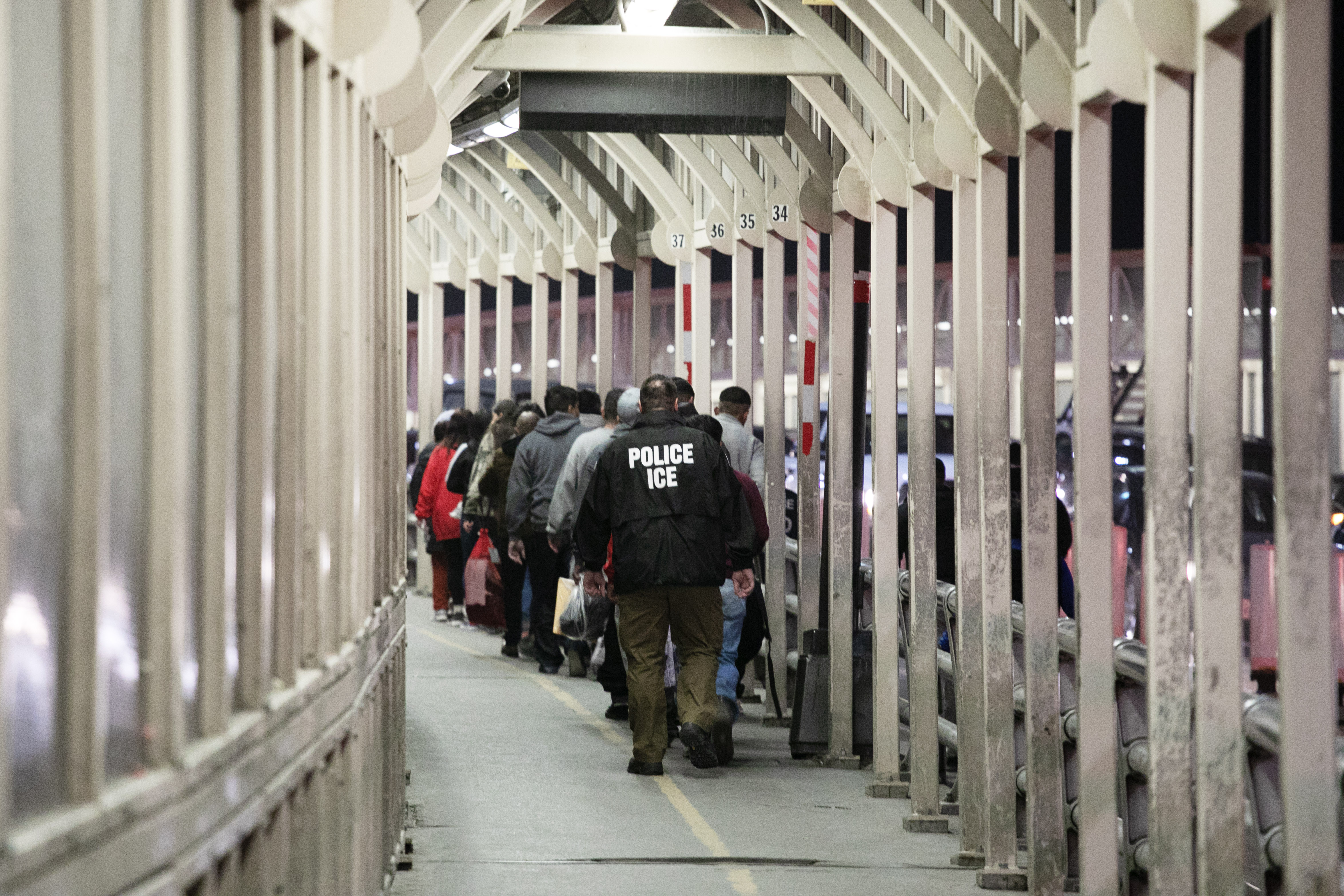 An ICE agent escorts a group of men being deported back across a bridge between El Paso, Texas and Juarez, Mexico on Thursday, Feb. 1, 2024. (Tom Hellauer, Denver Gazette) (TomHellauerMultimedia Producertom.hellauer@denvergazette.comhttps://denvergazette.com/content/tncms/avatars/f/9e/622/f9e6228a-3b6b-11ed-bf10-fbb71fa8e421.f54b911252c540f1d61709edc4727a39.png)