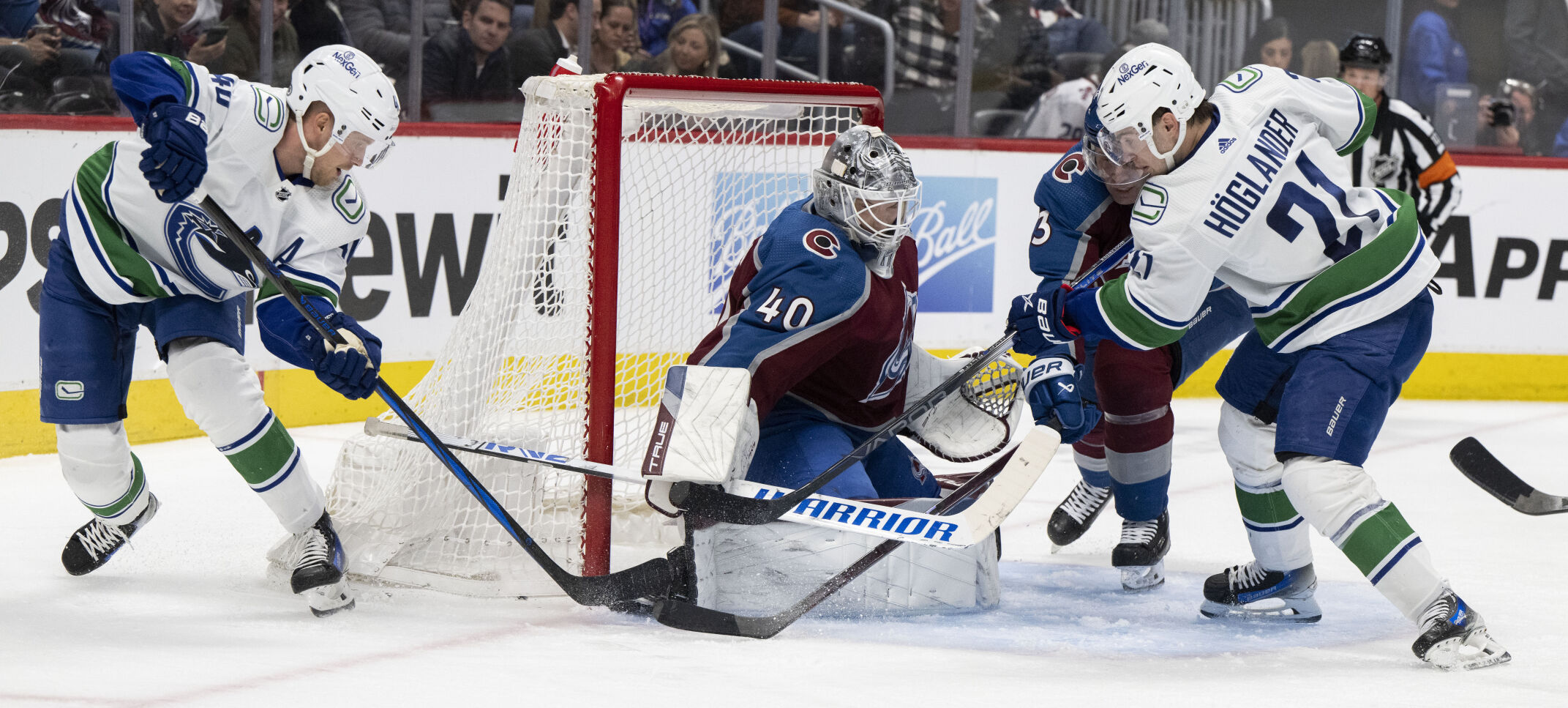 Colorado Avalanche goaltender Alexandar Georgiev (40) makes a save on a shot by Vancouver Canucks center Elias Pettersson (40) during the second period Tuesday, Feb. 20, 2024, at Ball Arena in Denver. (The Gazette, Christian Murdock) (Christian Murdock/The Gazette)