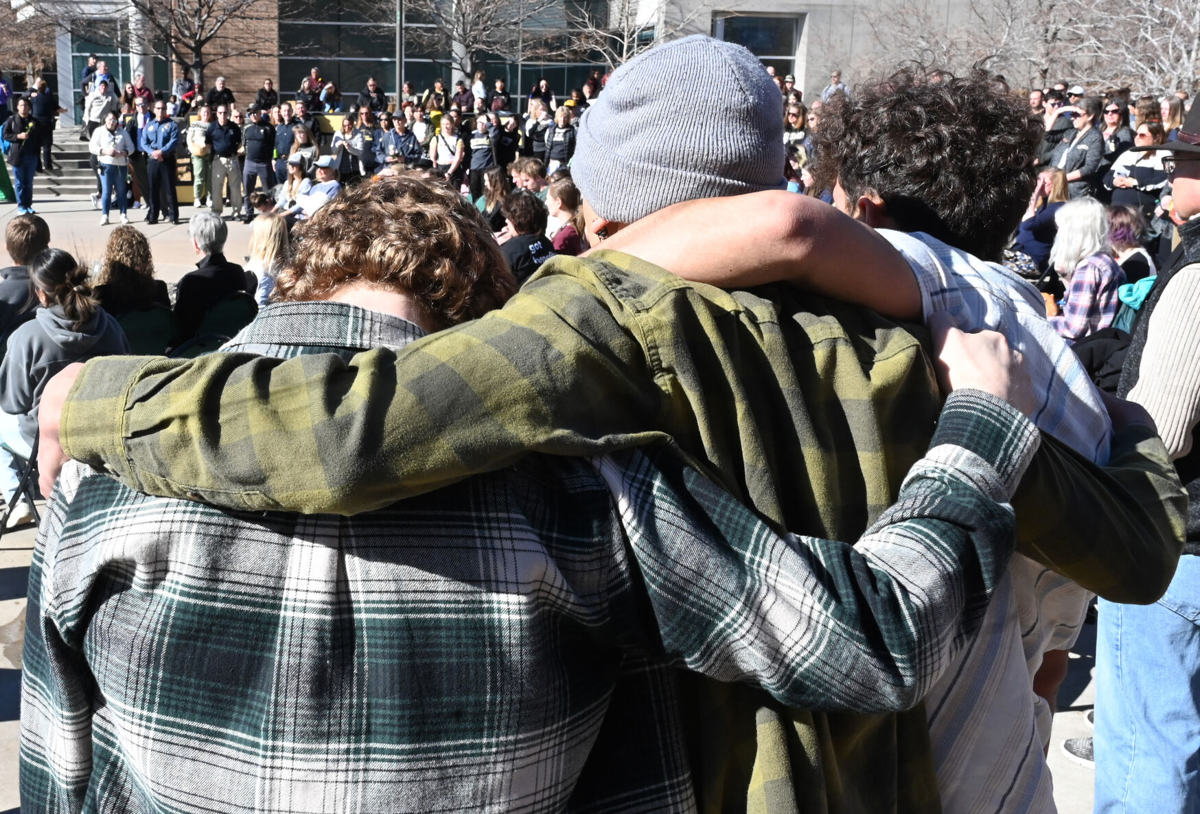 Friends of Sam Knopp hug after a Healing Walk at UCCS on Monday, Feb. 19, 2024. Knopp was one of the victims of a double homicide in a dorm last week. A suspect was arrested Monday. Also, a student suddenly died from a medical issue several days before the murders. (Photo by Jerilee Bennett, The Gazette)