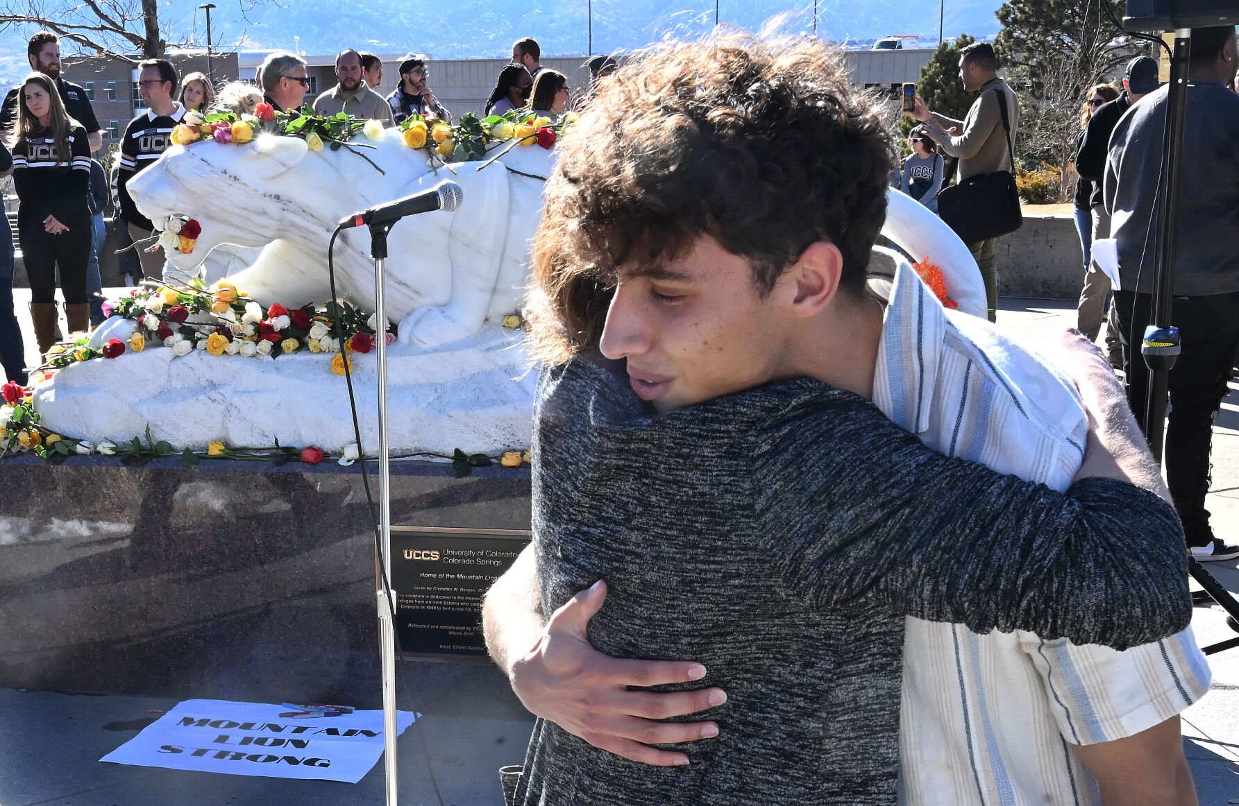 UCCS student Haden Gillespie gets a hug from UCCS Chancellor Jennifer Sobanet after a Healing Walk at UCCS on Feb. 19. Gillespie’s friend and roommate Samuel Knopp was one of the two people found dead in a dorm of  gunshot wounds. (Jerilee Bennett, Gazette file)