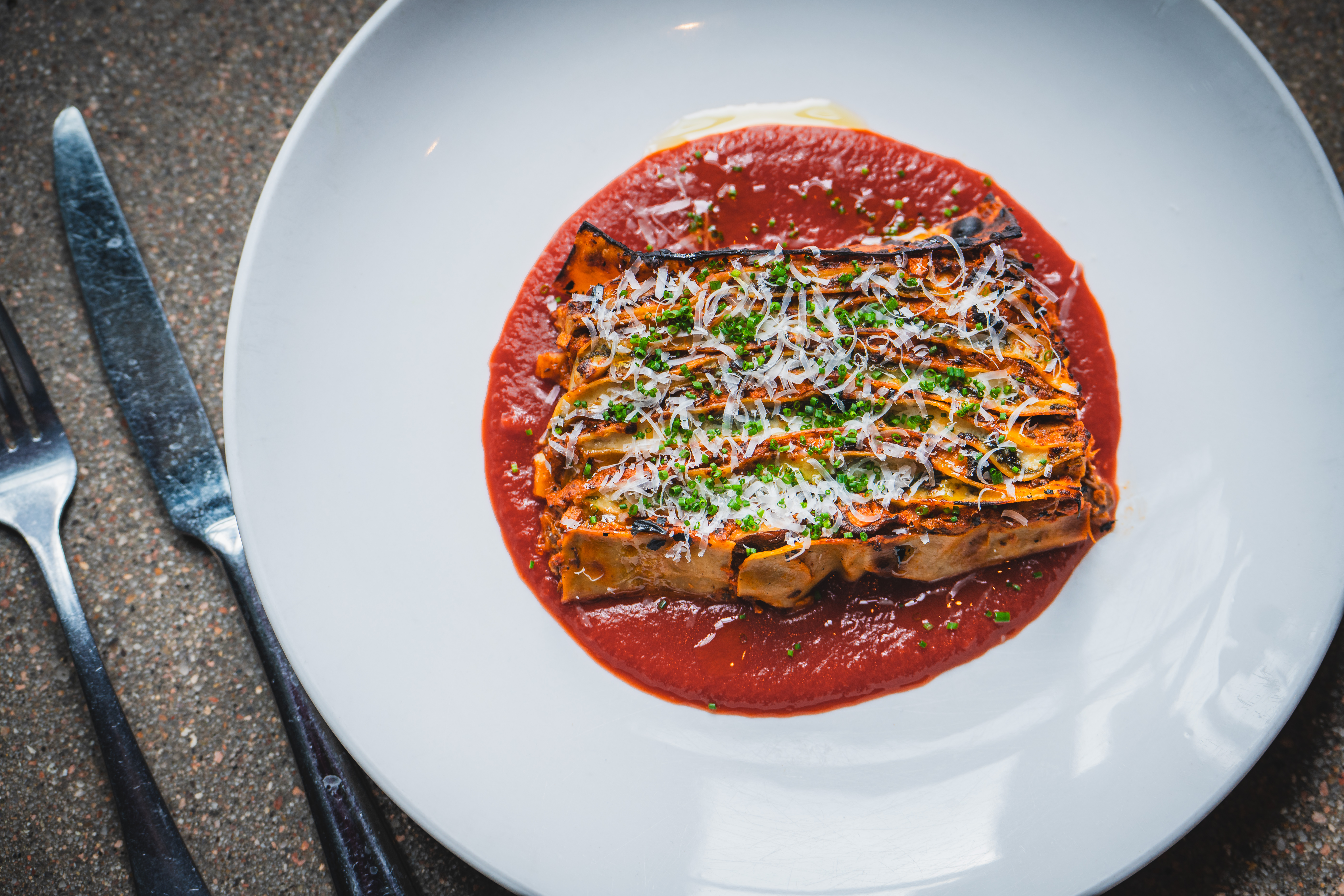 100 Layer Lasagna - Mushroom ragu, spinach, cotija, Morita tomato passata (Courtesy: Feed Media)