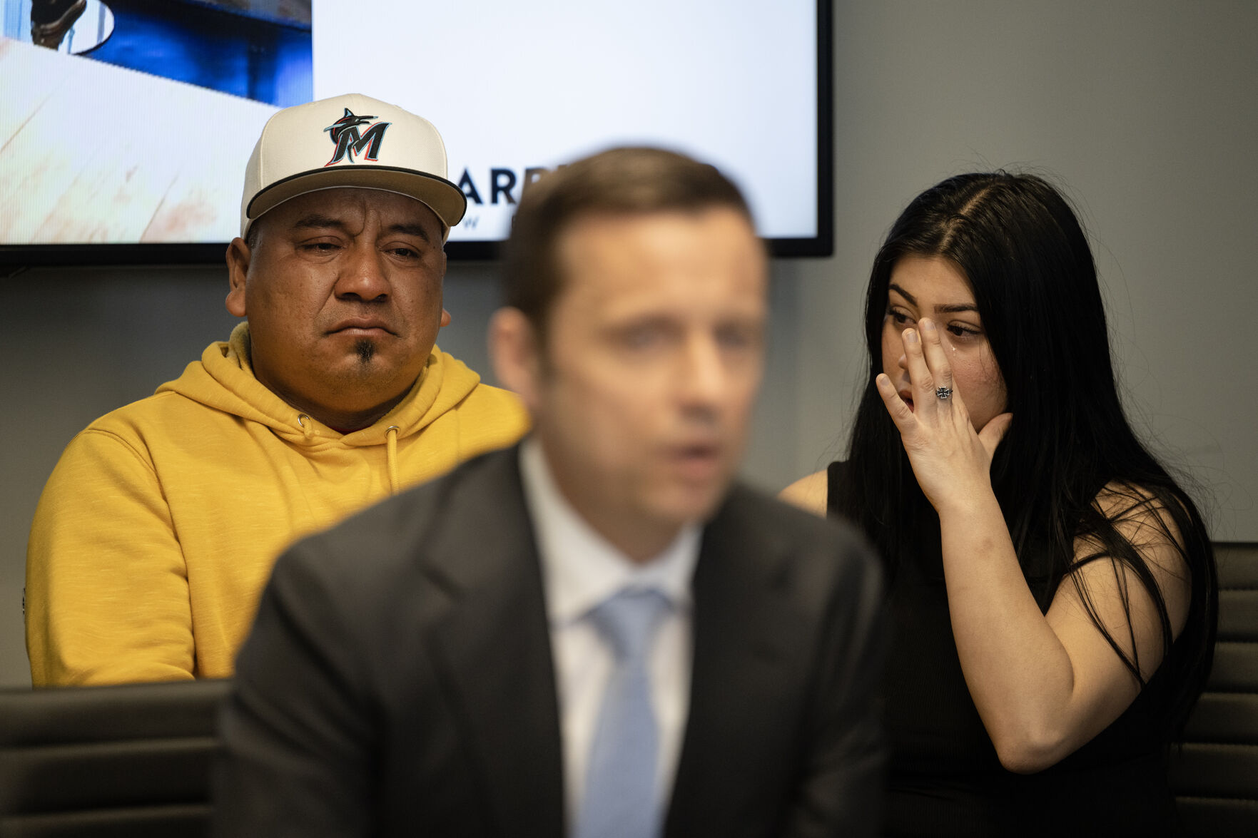 Jovana Garcia Bobadilla, the sister of Luis Garcia, who was shot on February 13th of 2023 in front of East High School and died two weeks later from his injuries, wipes away tears as the family’s attorney Matthew Barringer, speaks to media during a press conference at the Barringer Law Firm office on Tuesday, Feb. 13, 2024, in Greenwood Village, Colo. (Timothy Hurst/Denver Gazette) (TimHursttim.hurst@gazette.comhttps://secure.gravatar.com/avatar/aca82bd62b4ee425c598527cd6faa1b1?d=mm&r=g)