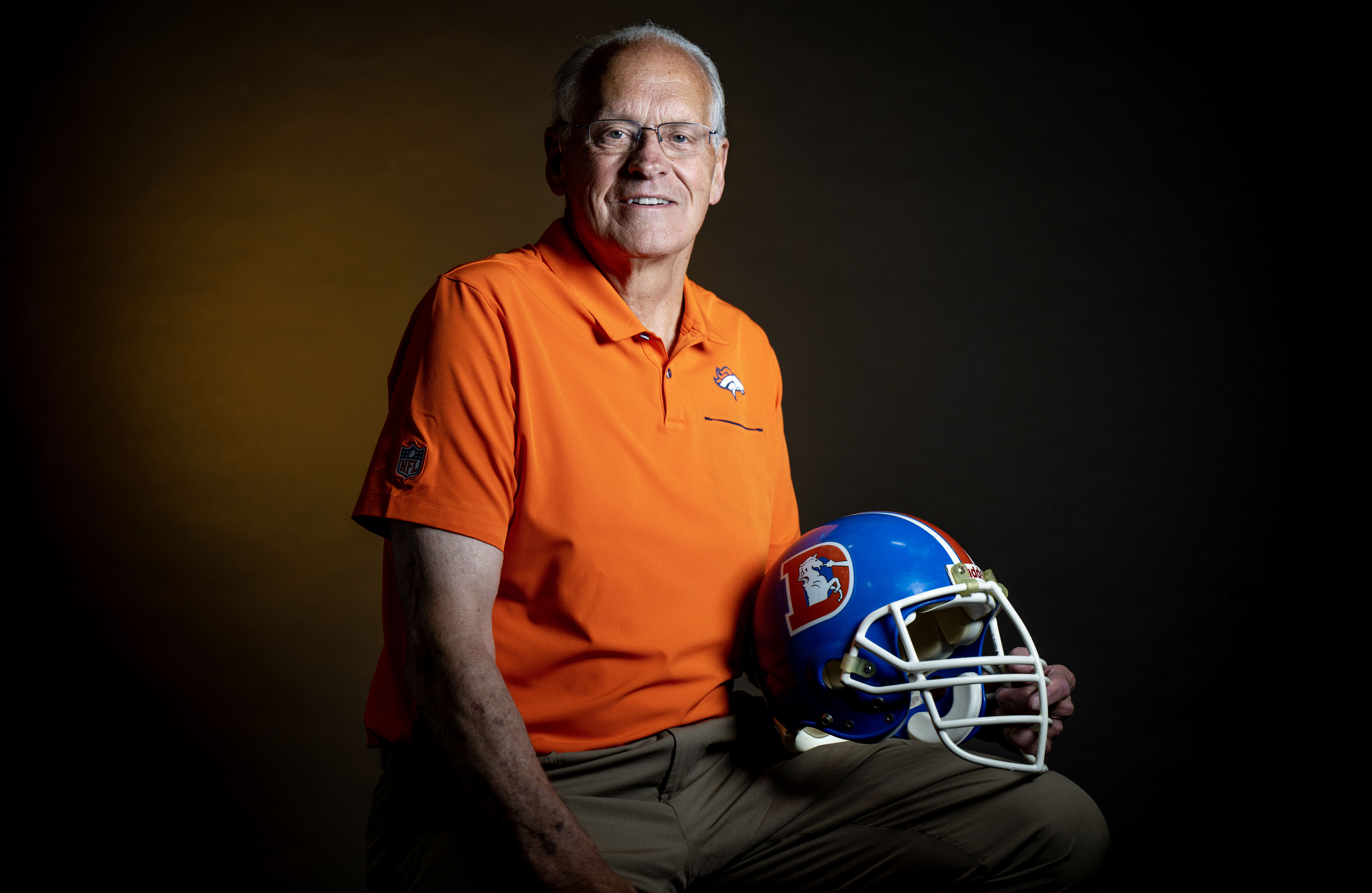 Former Denver Broncos player Randy Gradishar poses for a portrait with his old helmet at The Gazette’s studio in Colorado Springs, Colorado on Thursday, Aug. 24, 2023. (Parker Seibold, The Gazette) (Parker Seibold)
