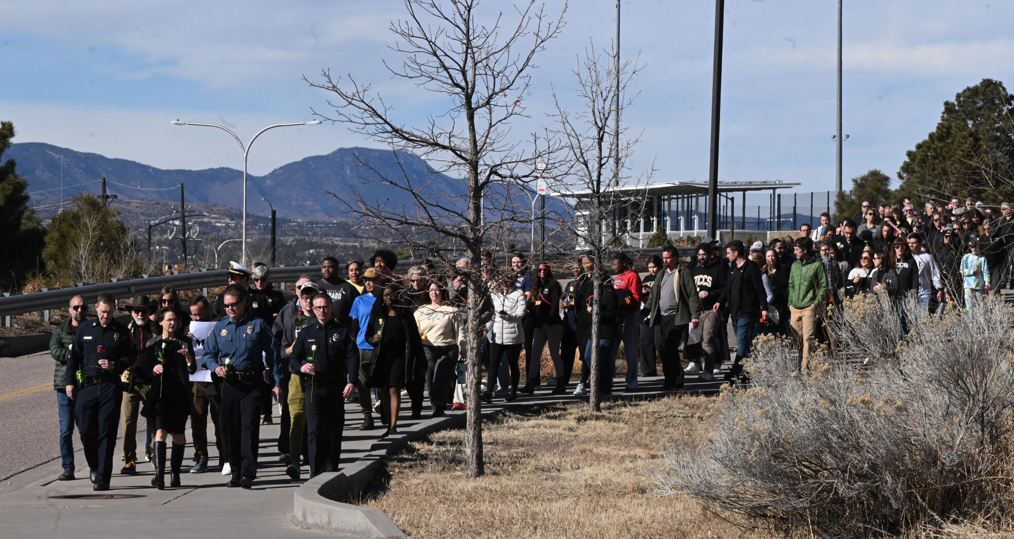 Hundreds participate in a Healing Walk at UCCS on Monday, Feb. 19, 2024. Two people were shot and killed in a dorm last Friday. A suspect was arrested Monday. Also, a student suddenly died from a medical issue several days before the murders. (Photo by Jerilee Bennett, The Gazette)