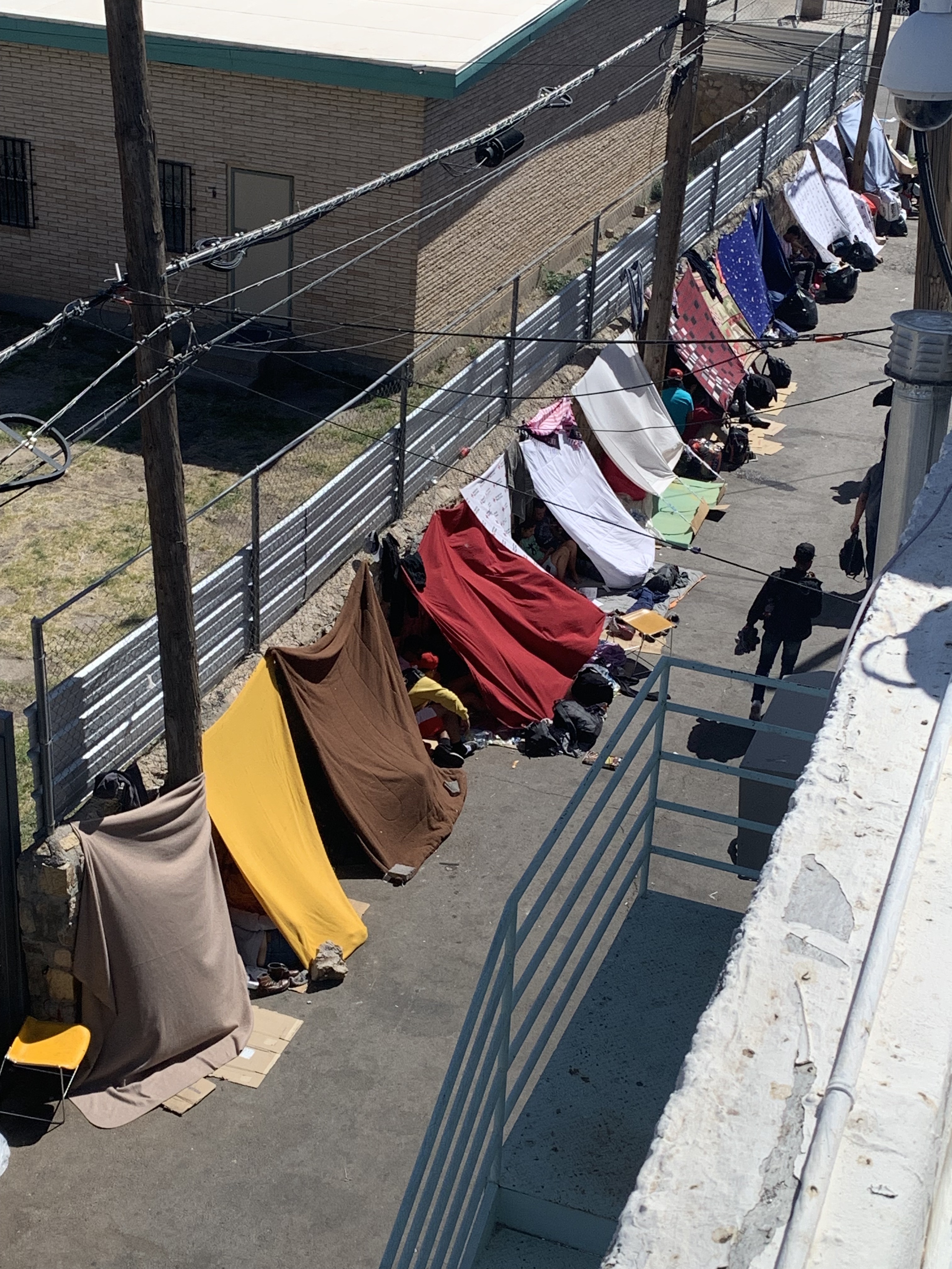 A surge in crossings last year coinciding with the end of Title 42, a Trump-era policy used to quickly expel immigrants to control the spread of COVID-19, quickly overwhelmed El Paso shelters. Newly arriving immigrants set up “lean-to” tents in the alley behind the men’s shelter at The Opportunity Center for the Homeless at 1208 Myrtle Avenue in El Paso, Texas in this May 9, 2023 courtesy photo. (Courtesy photo, John Martin)