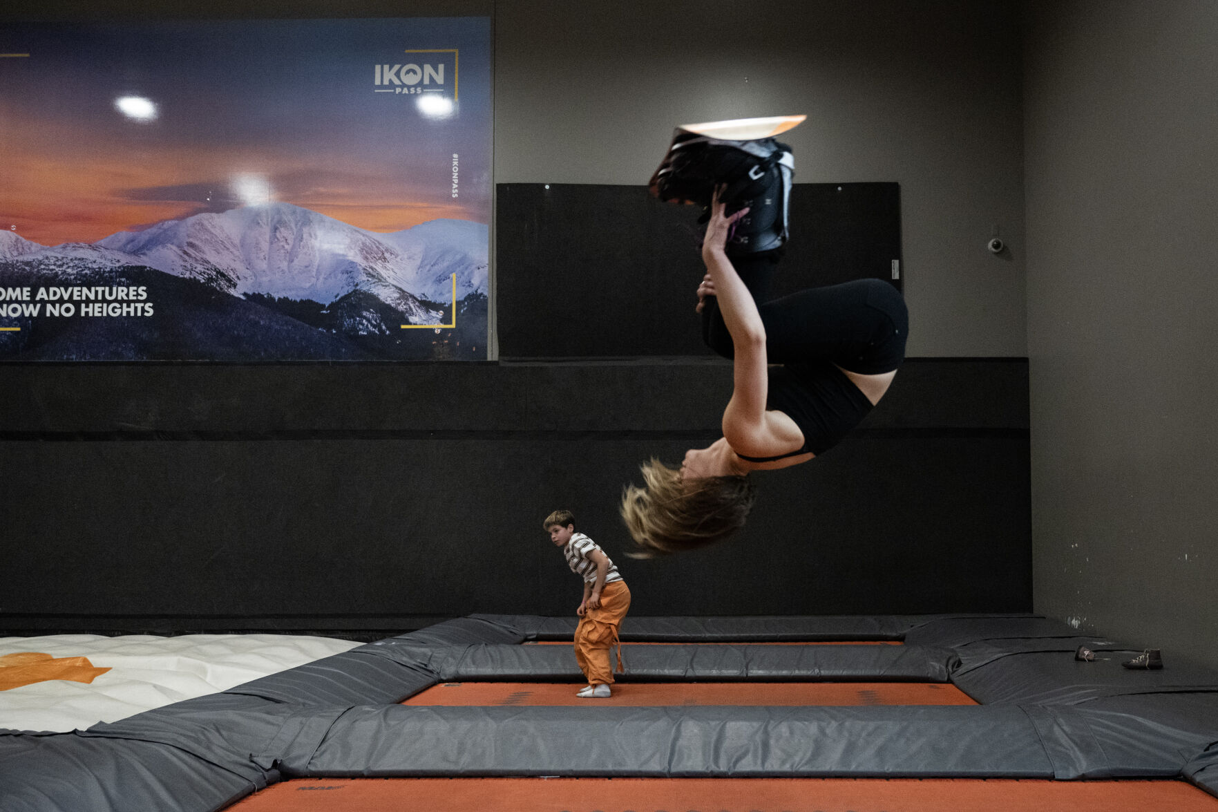 Emma Meyer, an aerialist and professional circus performer, does backflips on one of the large trampolines while strapped into a snowboard on Wednesday, Jan. 24, 2024, at SNÖBAHN Indoor Ski + Snowboard Center in Centennial. (TimHursttim.hurst@gazette.comhttps://secure.gravatar.com/avatar/aca82bd62b4ee425c598527cd6faa1b1?d=mm&r=g)