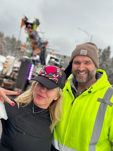 Monica Hustead poses with the Thera-ski group's tow truck driver who took the group's bus from Vail Pass to Idaho Springs, where the bus became stranded at midnight and stayed until around 11:30 a.m. Thursday. (Courtesy photo, Kris. Kerr)