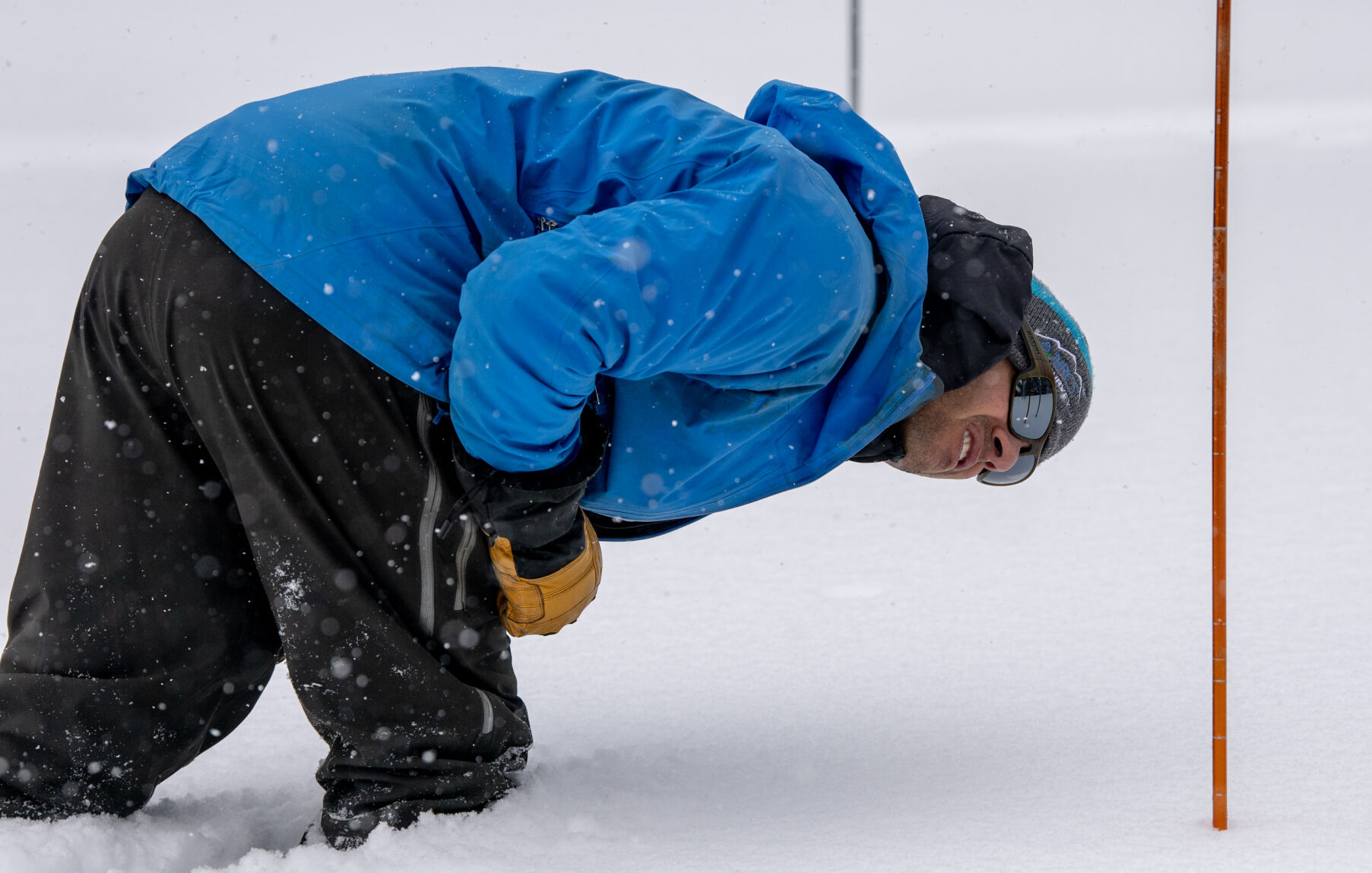 Brian Domonkos, the snow survey supervisor for the Natural Resources Conservation Service, takes a snow measurement at the Berthoud Pass SNOTEL site on March 2. (Parker Seibold, The Gazette)