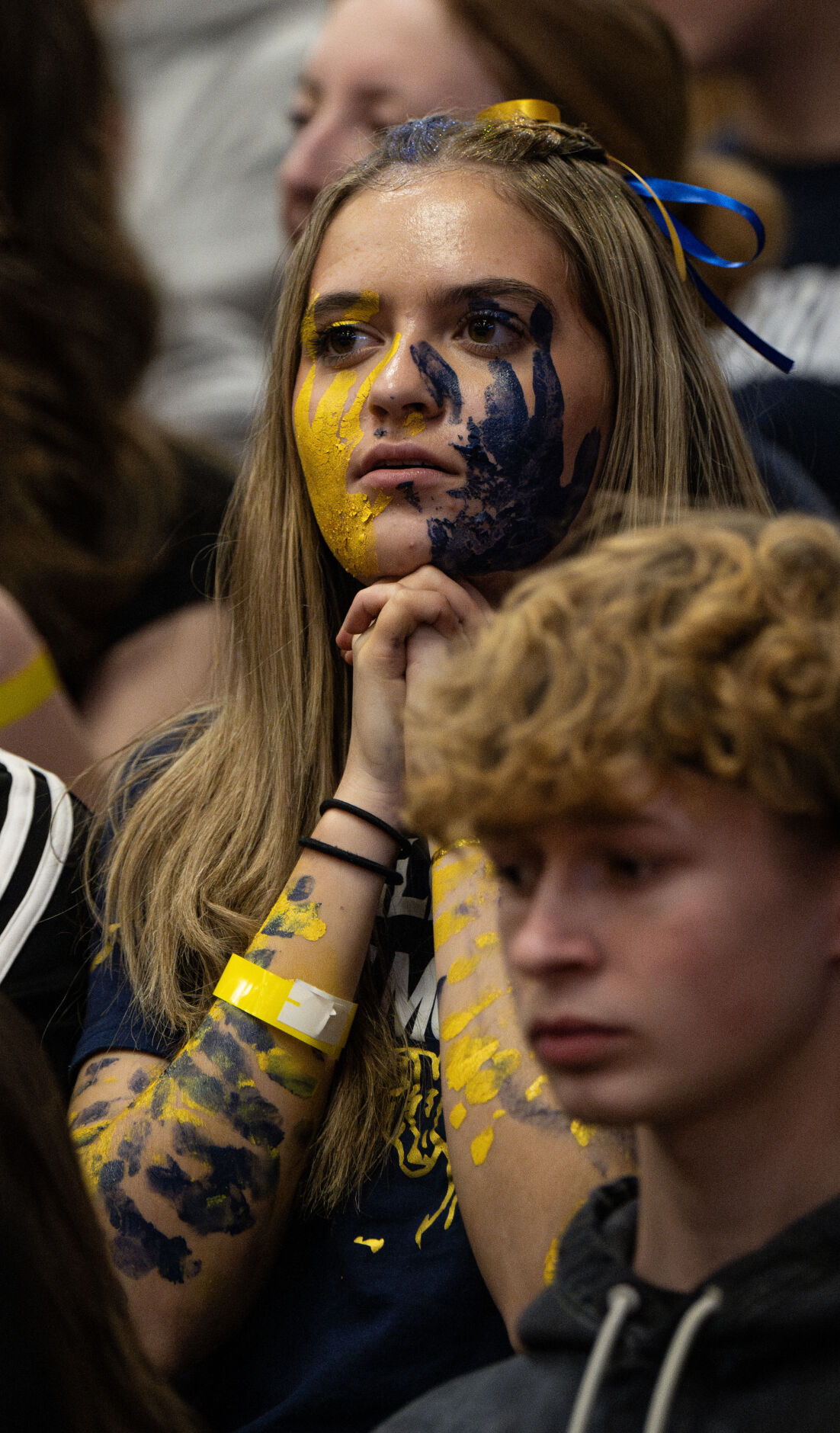 A Vanguard fan watches nervously in the final quarter of the 3A boys basketball state championships on Saturday, March 9, 2024, at the University of Denver’s Hamilton Gym in Denver. (Parker Seibold, The Gazette) (Parker Seibold)