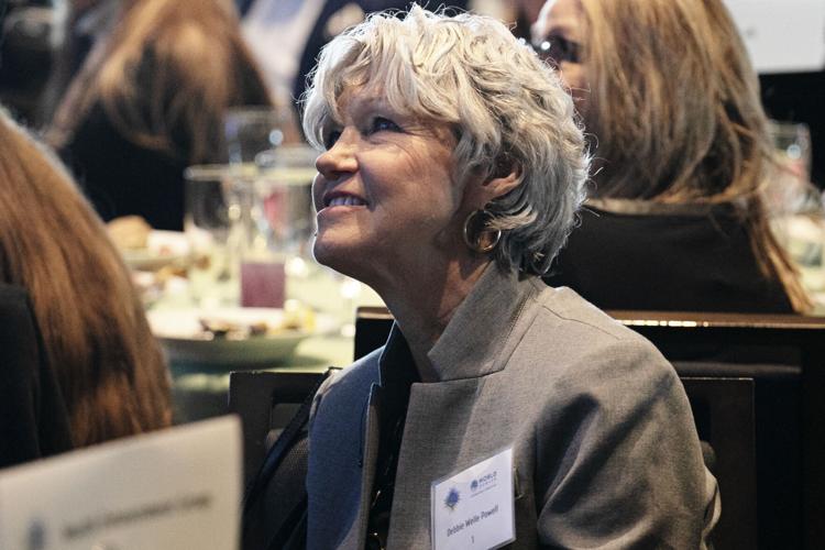 Debbie Powell listens to speakers
