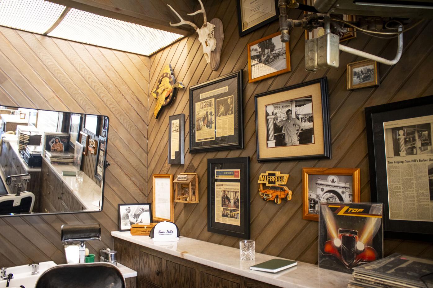 Gallery wall inside Sam Hill's Barbershop by Arrow