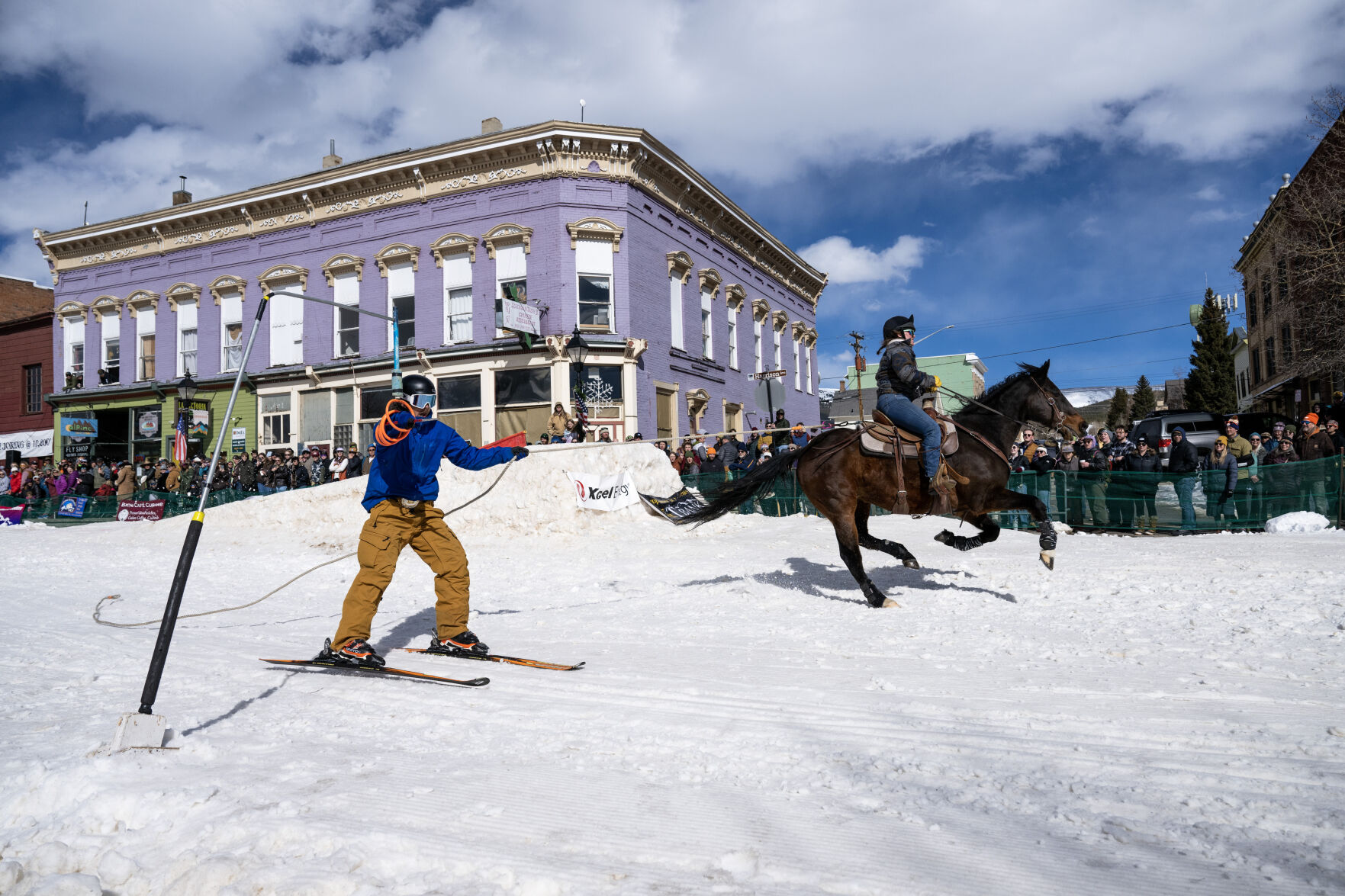 A skier grabs a ring as they are pulled through the course at the 76th Annual Leadville Ski Joring on Saturday, March 2, 2024, in Leadville, Colo. (Parker Seibold, The Gazette) (Parker Seibold)
