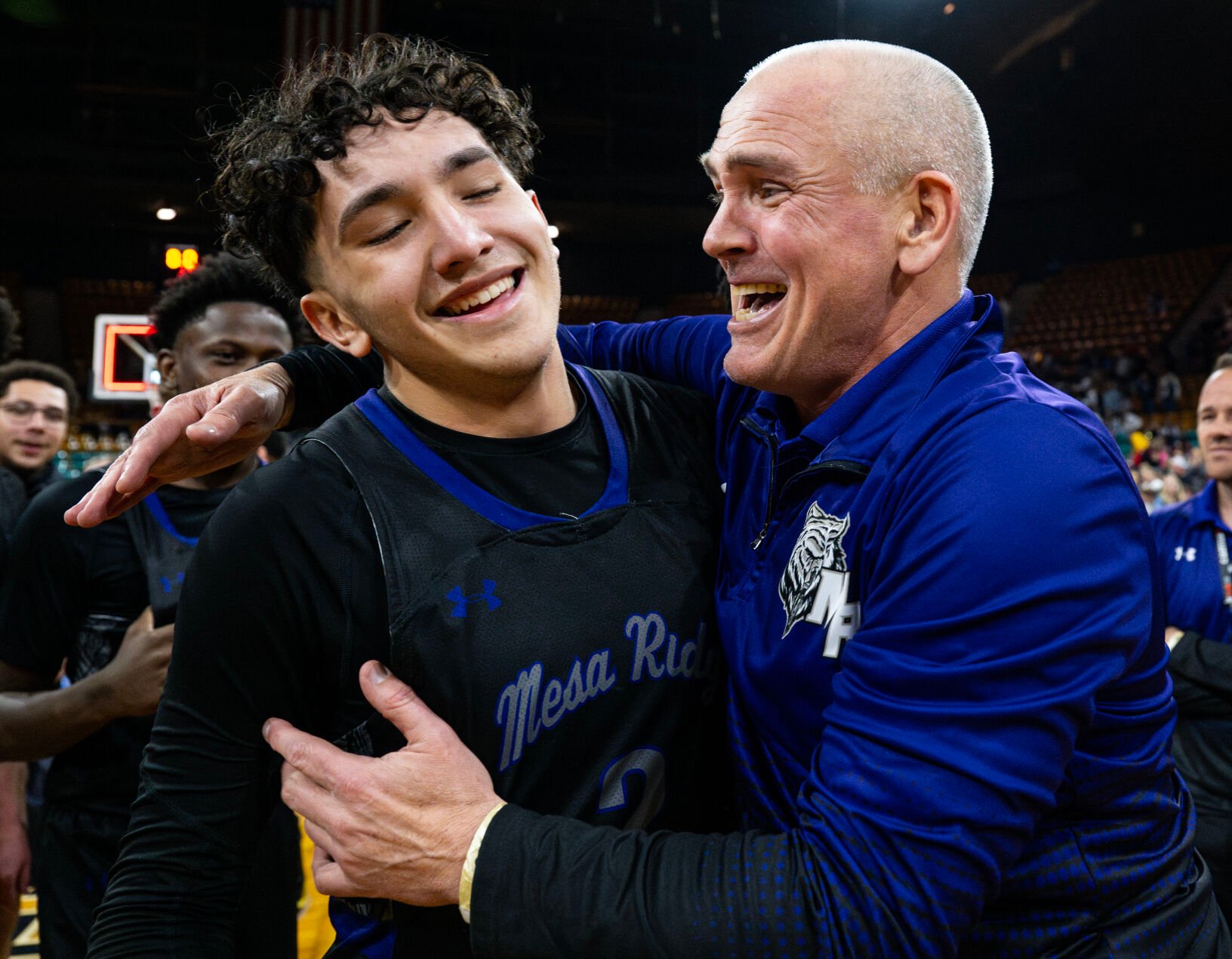 Mesa Ridge players and coaches celebrate in the second half of the 5A state championships Saturday at the Denver Coliseum in Denver. The Grizzlies won 57-53. (Parker Seibold, The Gazette) (Photos by Parker Seibold)