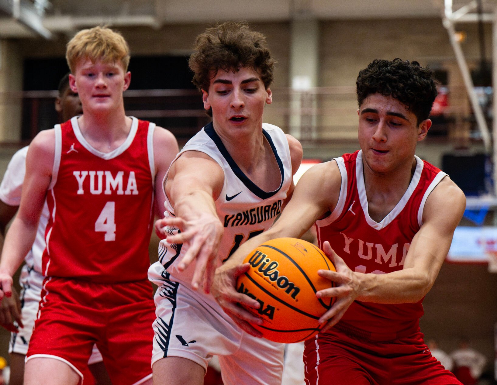 Vanguard’s Mason Hoover (15) and Yuma’s Cristian Duarte (13) reach for the ball as it nearly goes out of bounds in the second half of the 3A boys basketball state championships on Saturday, March 9, 2024, at the University of Denver’s Hamilton Gym in Denver. Vanguard lost 55-54. (Parker Seibold, The Gazette) (Parker Seibold)