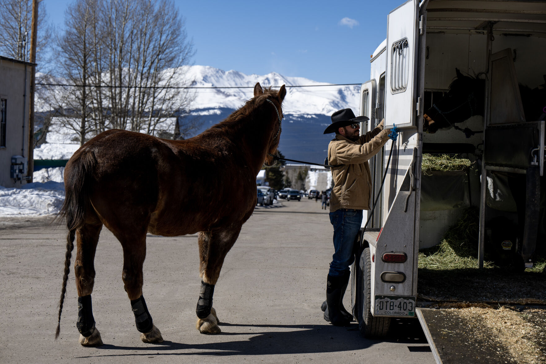 Ryan McNeil ties his horse Boxer to his trailer at the 76th Annual Leadville Ski Joring on Saturday, March 2, 2024, in Leadville, Colo. (Parker Seibold, The Gazette) (Parker Seibold)