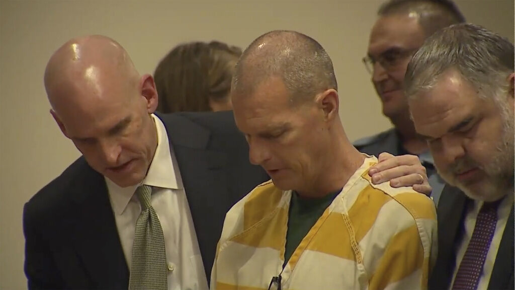 Lawyers console paramedic Peter Cichuniec after his sentence is read on Friday, March 1, 2024 in Brighton, Colo. Cichuniec was sentenced to five years in prison for the death of Elijah McClain in a rare prosecution of medical responders that has left officials rethinking how they treat people in police custody.(Colorado State Court via AP, POOL) (POOL)