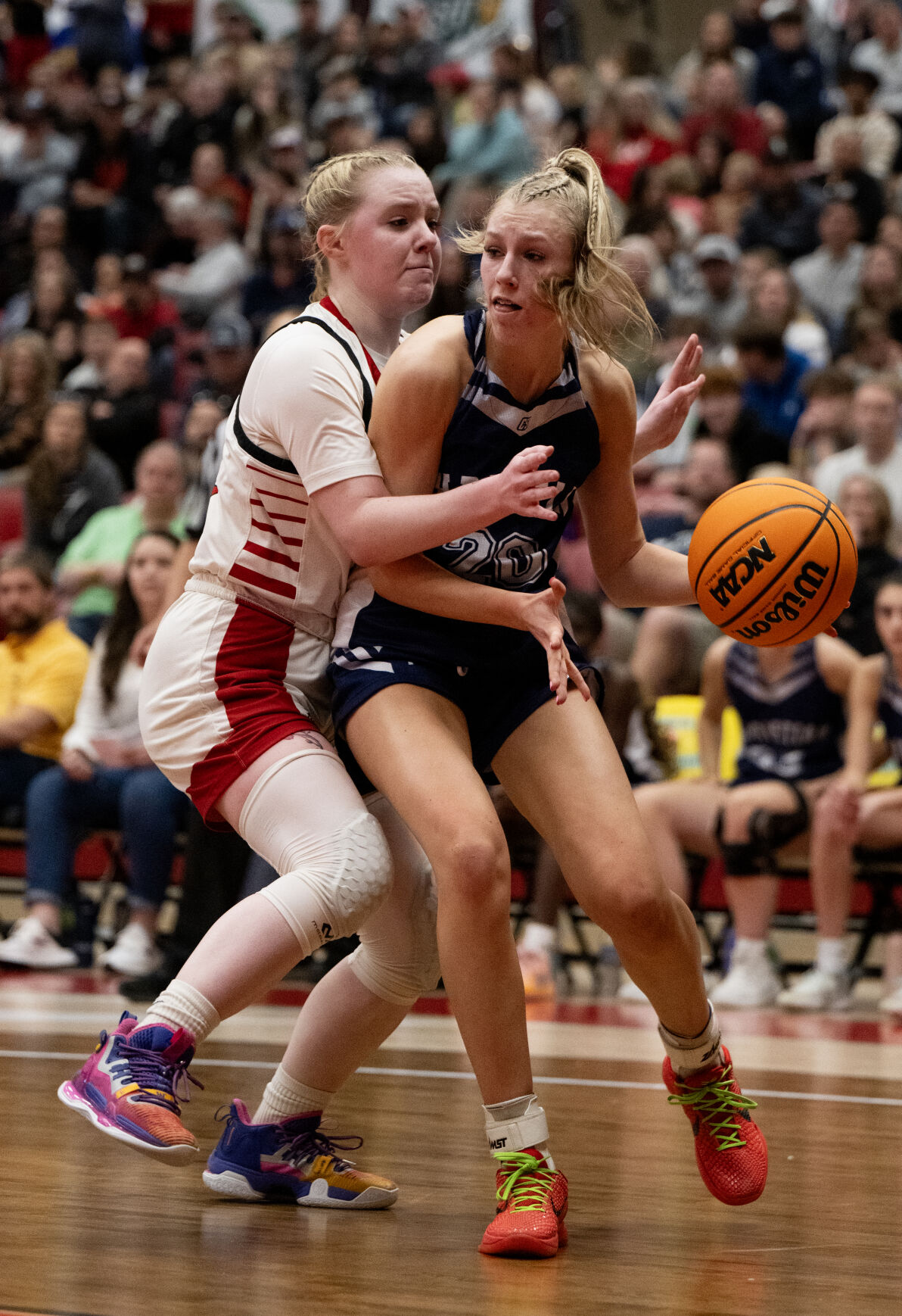 Colorado Springs Christian School’s Kinley Asp (20) is guarded by Peyton’s Scarlett Clark (32) in the second half of the 3A girls basketball state championships on Saturday, March 9, 2024, at the University of Denver’s Hamilton Gym in Denver. (Parker Seibold, The Gazette) (Parker Seibold)