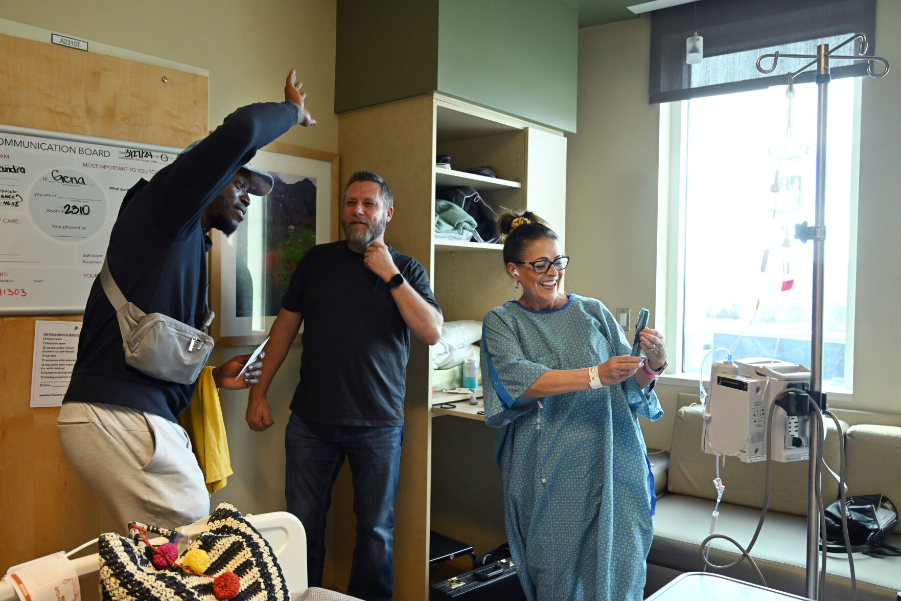 Denver Nuggets’ Reggie Jackson does a FaceTime with UCHealth Memorial Hospital North patient Gena Rosales to her son while visiting patients at the hospital on Thursday, March 28, 2024. Jackson is from Colorado Springs and played for Palmer High School before being a player in the NBA. (Photo by Jerilee Bennett, The Gazette)
