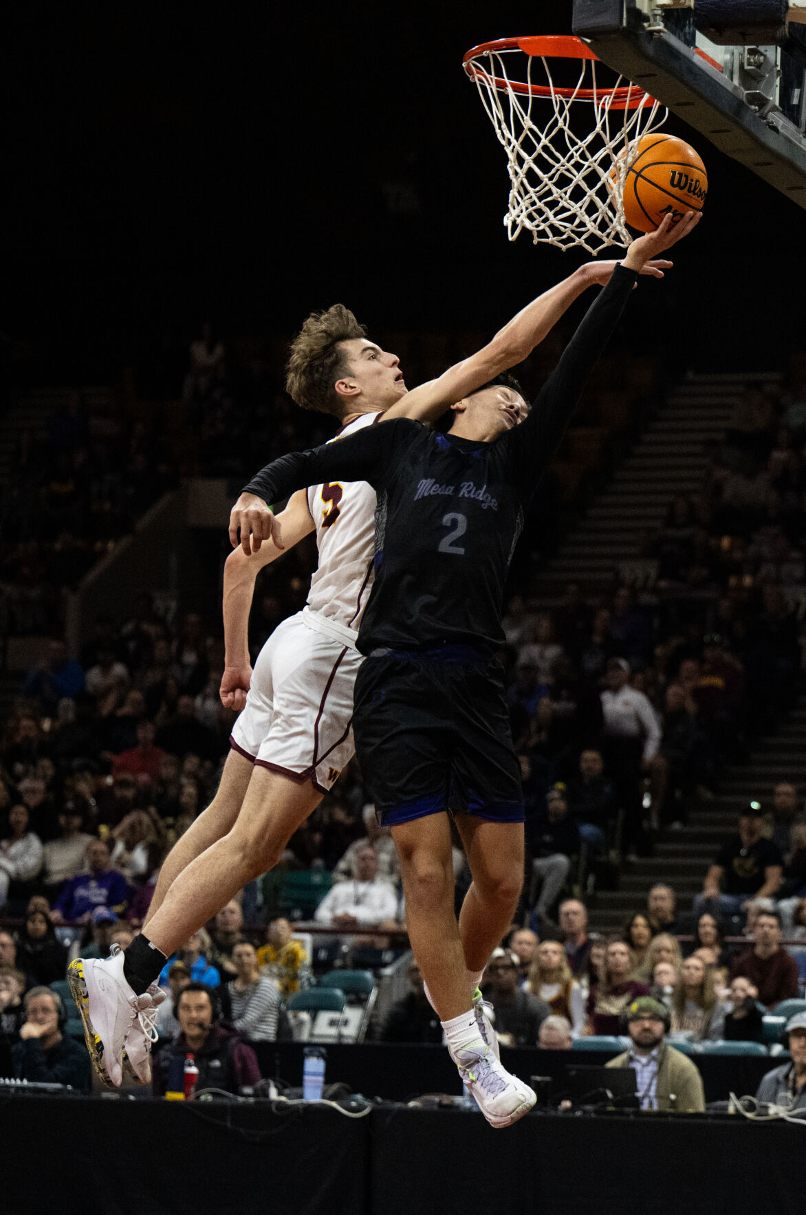 Mesa Ridge’s Bryce Riehl (2) is fouled by Windsor’s Madden Smiley (5) as he makes a basket in the first half of the 5A boys basketball championships on Saturday, March 9, 2024, at the Denver Coliseum in Denver. (Parker Seibold, The Gazette) (Parker Seibold)