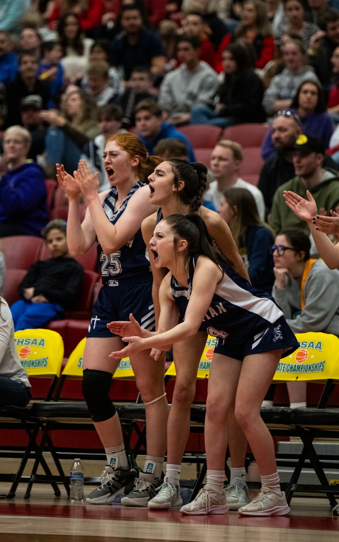 Colorado Springs Christian School’s Abigail Perry (25), Capri Simpson (5) and Avery Leffingwell (4) cheer from the sidelines in the second half of the 3A girls basketball state championships on Saturday, March 9, 2024, at the University of Denver’s Hamilton Gym in Denver. (Parker Seibold, The Gazette) (Parker Seibold)