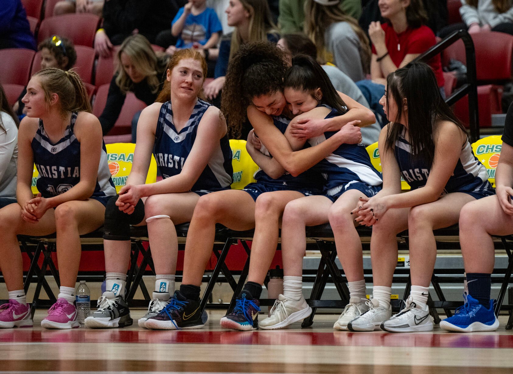 Colorado Springs Christian School’s Grace Minihane, left, and Avery Leffingwell (4) embrace on the bench in the second half of the 3A girls basketball state championships on Saturday, March 9, 2024, at the University of Denver’s Hamilton Gym in Denver. (Parker Seibold, The Gazette) (Parker Seibold)