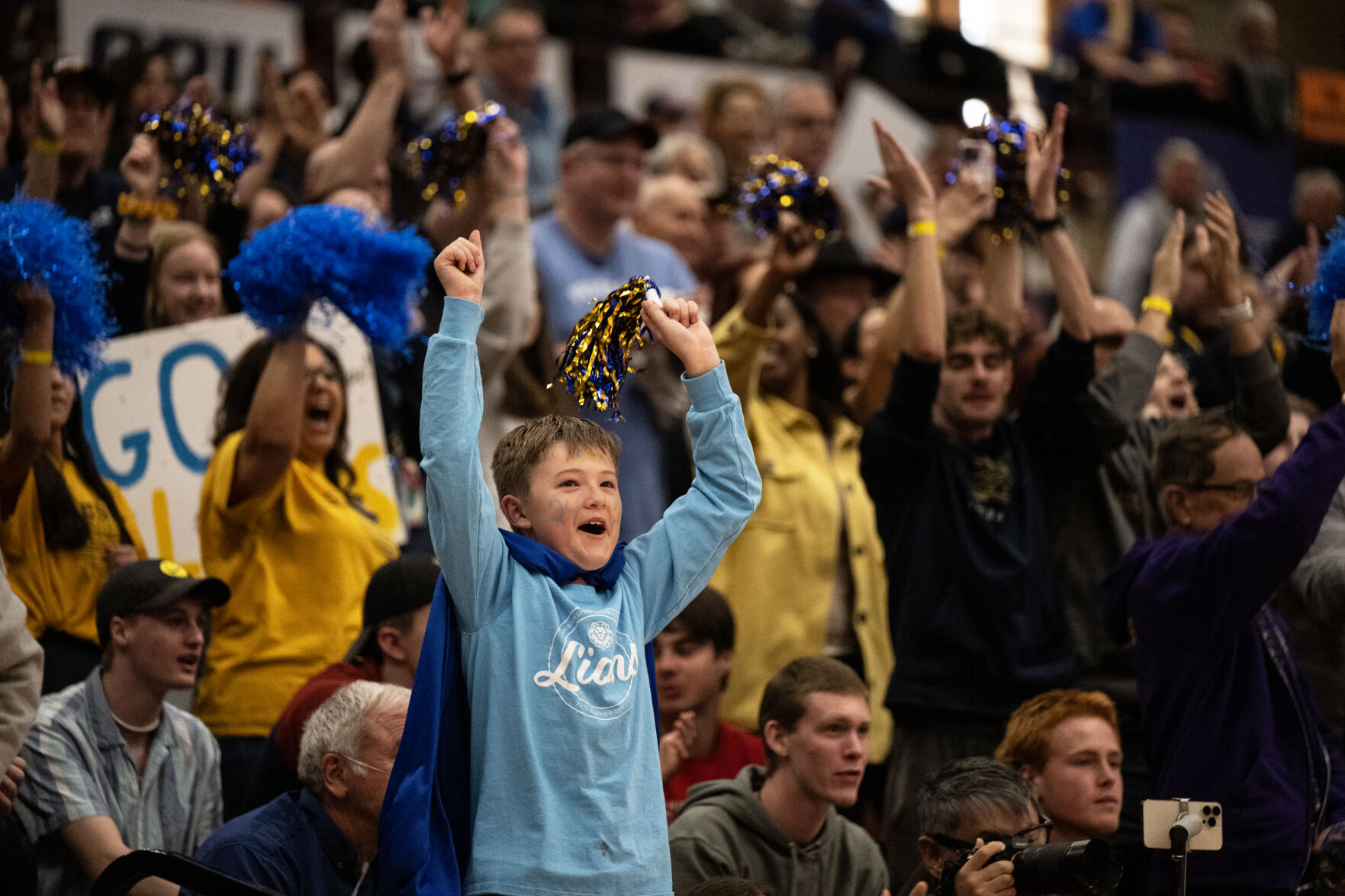 A Colorado Springs Christian School Lions fan cheers in the second half of the 3A girls basketball state championships on Saturday, March 9, 2024, at the University of Denver’s Hamilton Gym in Denver. (Parker Seibold, The Gazette) (Parker Seibold)
