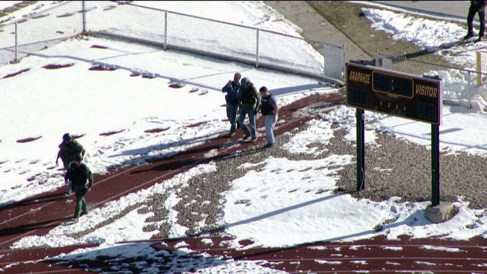 FILE PHOTO: In this still image taken from video provided by Fox 31 Denver, police respond to reports of a shooting at Arapahoe High School in Centennial, Colo. Friday, Dec. 13, 2013. Colorado division of emergency management spokeswoman Micki Trost said her director went to the school and their weren't any more immediate details. (AP Photo/KDVR) (File photo, Associated Press via KDVR)