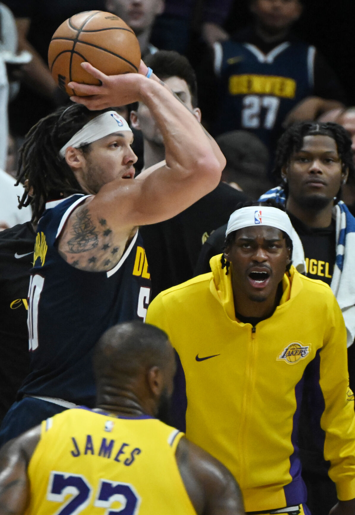 Aaron Gordon shoots 3 at the end of the second quarter as Lakers’ Jared Vanderbilt doesn’t look happy during game 5 of the first round of the Western Conference championships on Monday, April 29, 2024. (Photo by Jerilee Bennett, The Gazette)