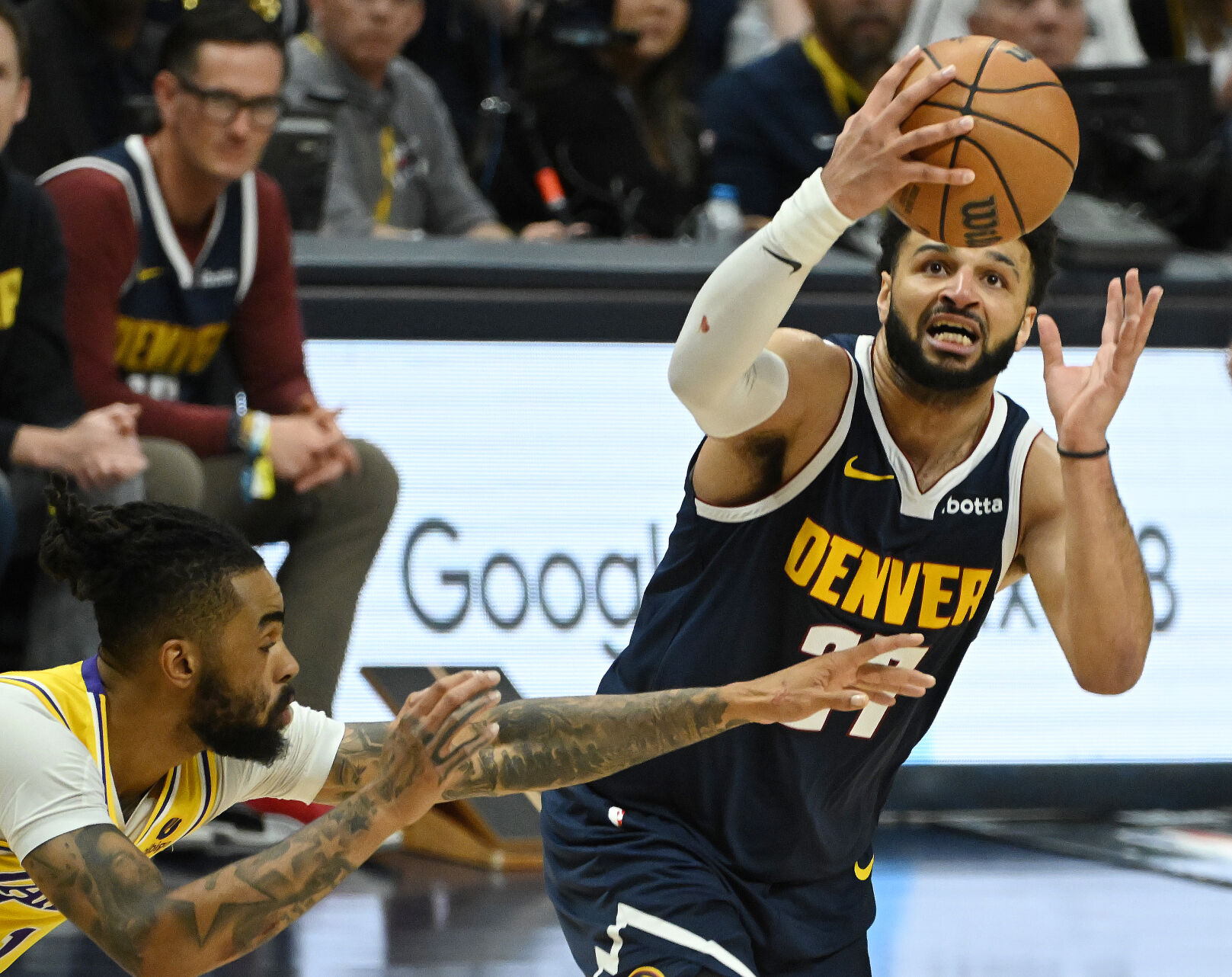 Jamal Murray takes a shot past Lakers’ D’Angelo Russell during game 5 of the first round of the Western Conference championships at Ball Arena on Monday, April 24, 2024. The Nuggets won the game 108-106. (Photo by Jerilee Bennett, The Gazette)