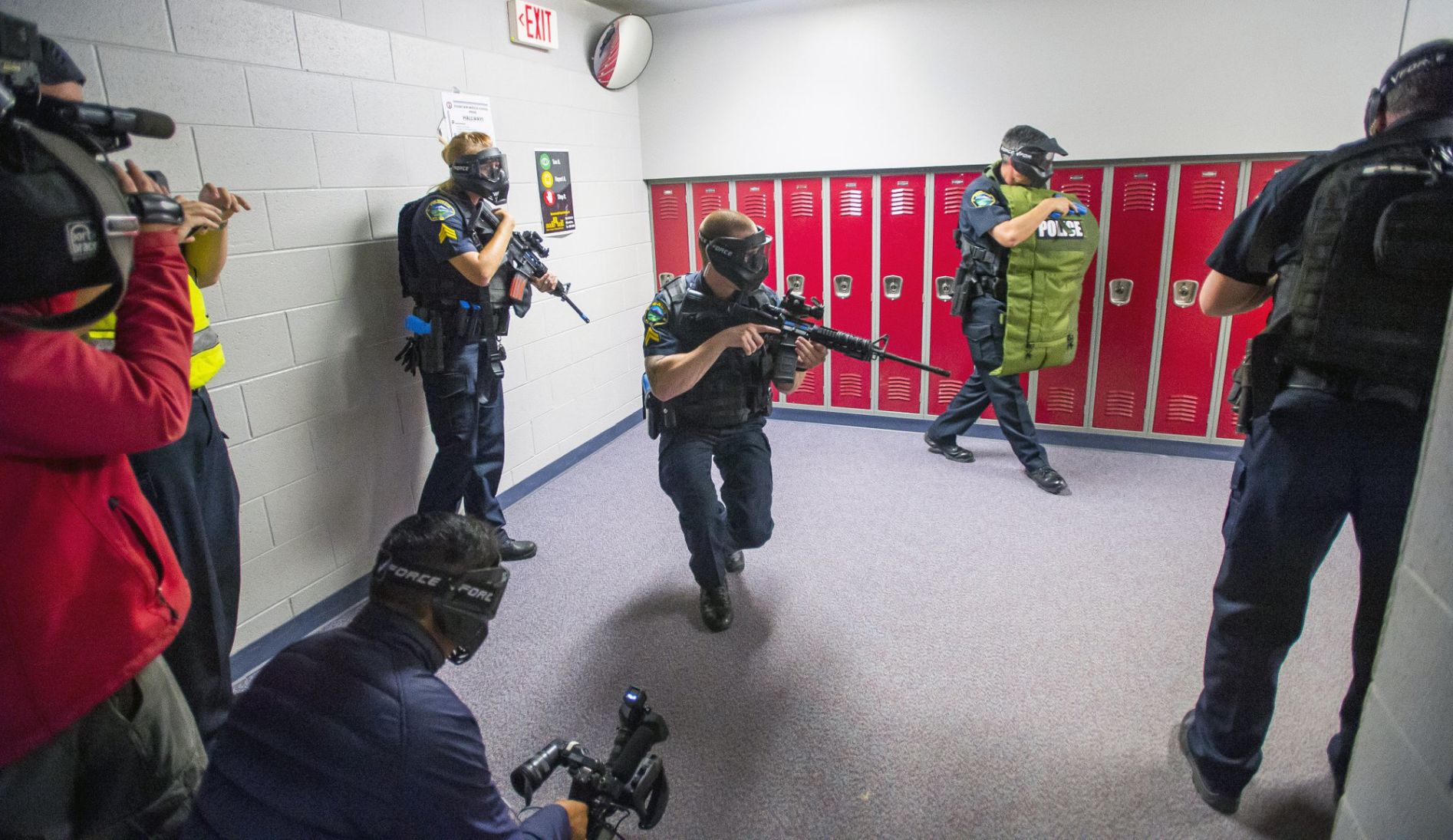 In this June 9, 2017, file photo, members of the Fountain Police Department take part in Active Shooter Response Training exercise at Fountain Middle School in Fountain. Twenty years after the Columbine High School shooting made practicing for armed intruders as routine as fire drills, many parents have only tepid confidence in the ability of schools to stop a gunman, according to a new poll by The Associated Press-NORC Center for Public Affairs Research. (The Gazette file photo)