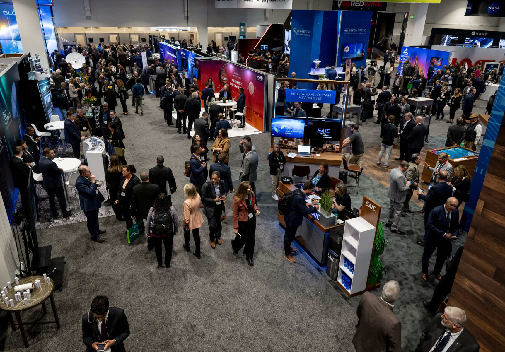Attendees of the 39th Space Foundation Space Symposium make their way through an exhibition hall at The Broadmoor Hotel, Tuesday, April 9, 2024, in Colorado Springs, Colo. Thousands of space professionals attend the symposium each year. (Parker Seibold, The Gazette) (Parker Seibold)