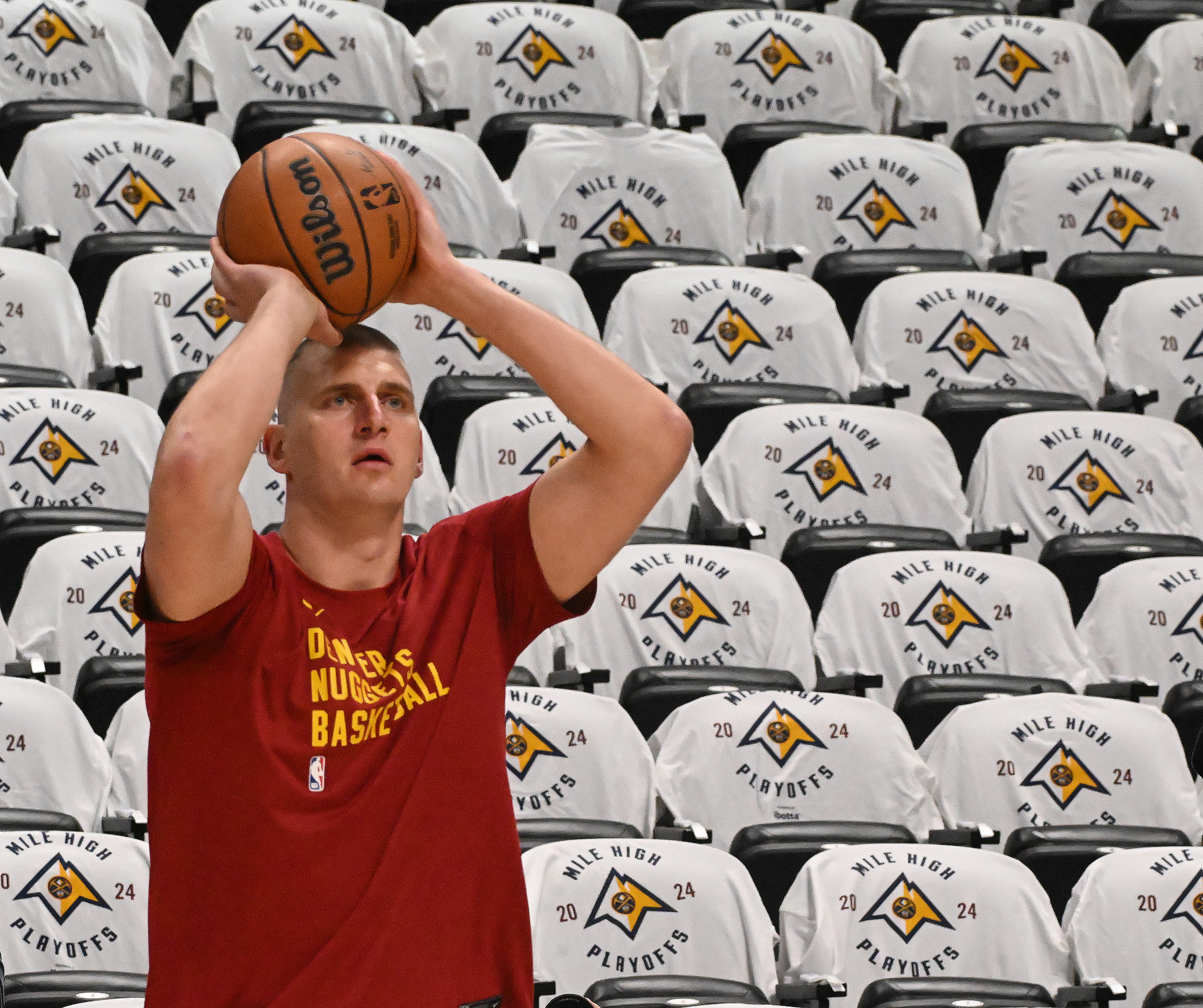 Nuggets superstar Nikola Jokic warms up before the first game of the playoffs at Ball Arena on Saturday, April 20, 2024 amongst a sea of playoffs t-shirts. Jokic is one of the favorites to win NBA MVP this year for a third time. The Nuggets are taking on the Lakers for Round 1 of the Western Conference championship in a best of 7 series. All of the 41 of the Nuggets' home games at Ball Arena were sold out this season, after winning the NBA World Championship last year. (Photo by Jerilee Bennett, The Gazette)