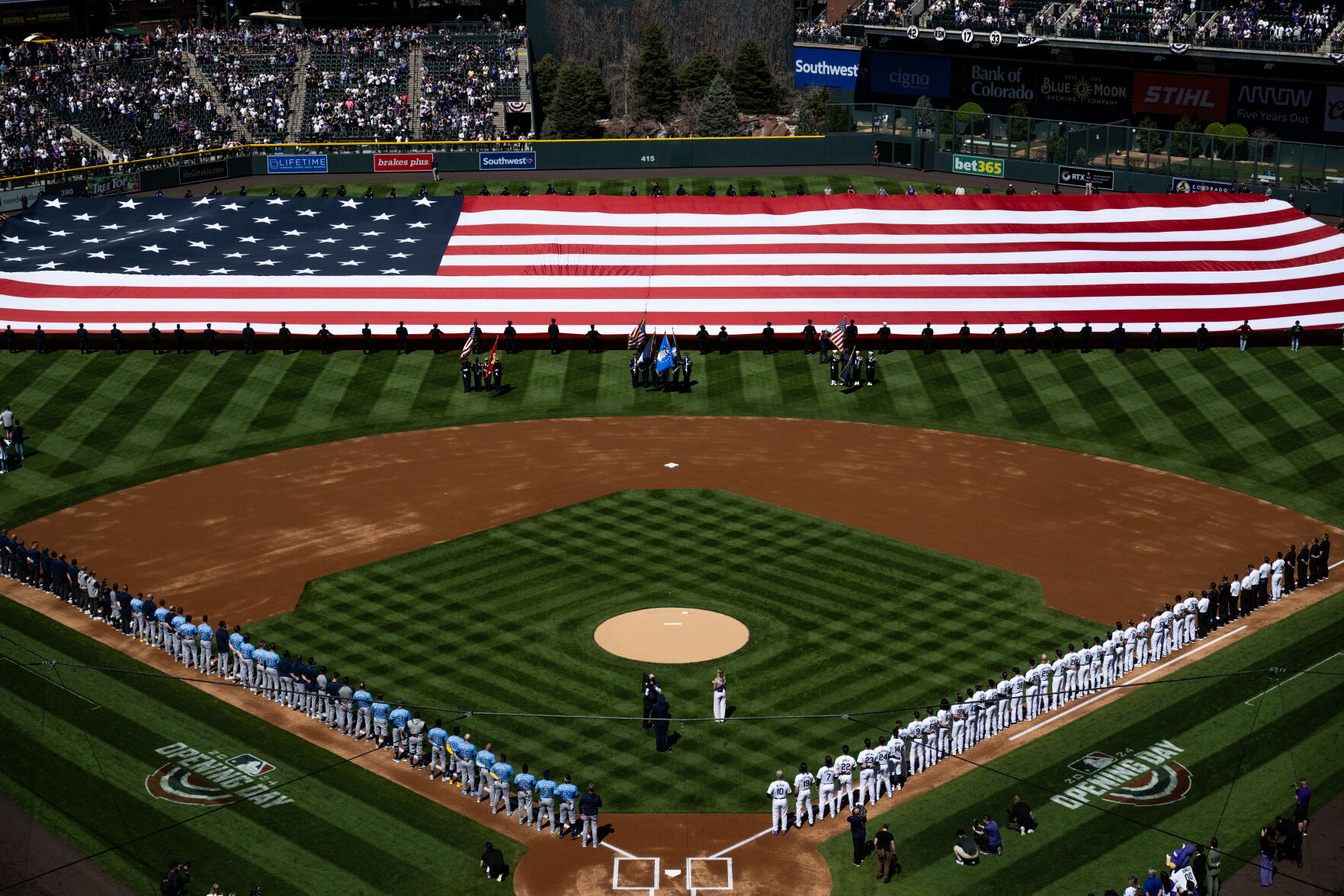 The National Anthem kicks off the Colorado Rockies opening day at Coors Field, Friday, April 5, 2024, in Denver, Colo. (Parker Seibold, The Gazette) (Parker Seibold)