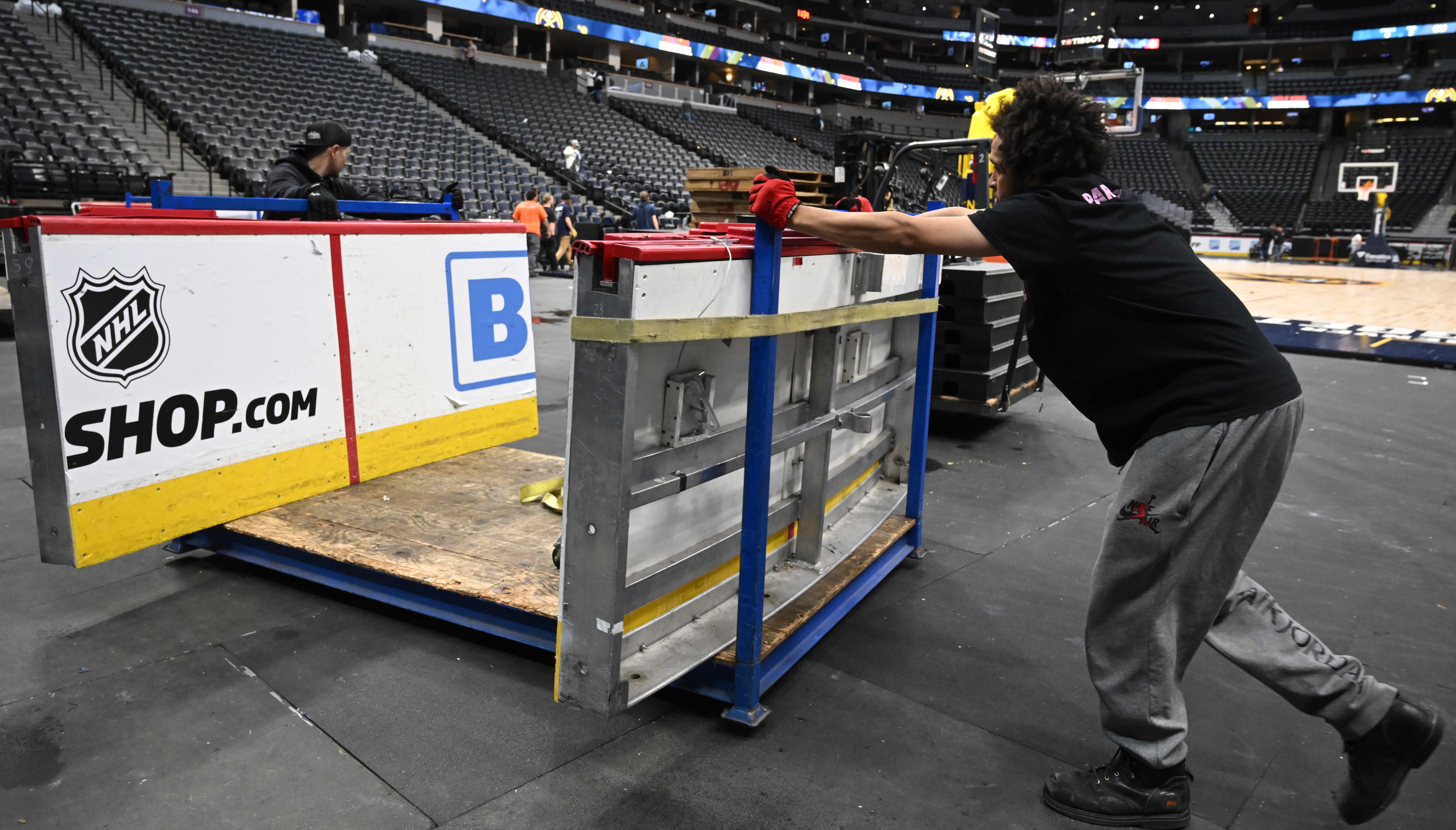 The walls of Avalanche ice rink are brought out to put into place. Ball Arena was transformed from Nuggets to Avalanche overnight on Thursday, March 21, 2024. (Photo by Jerilee Bennett, The Gazette)