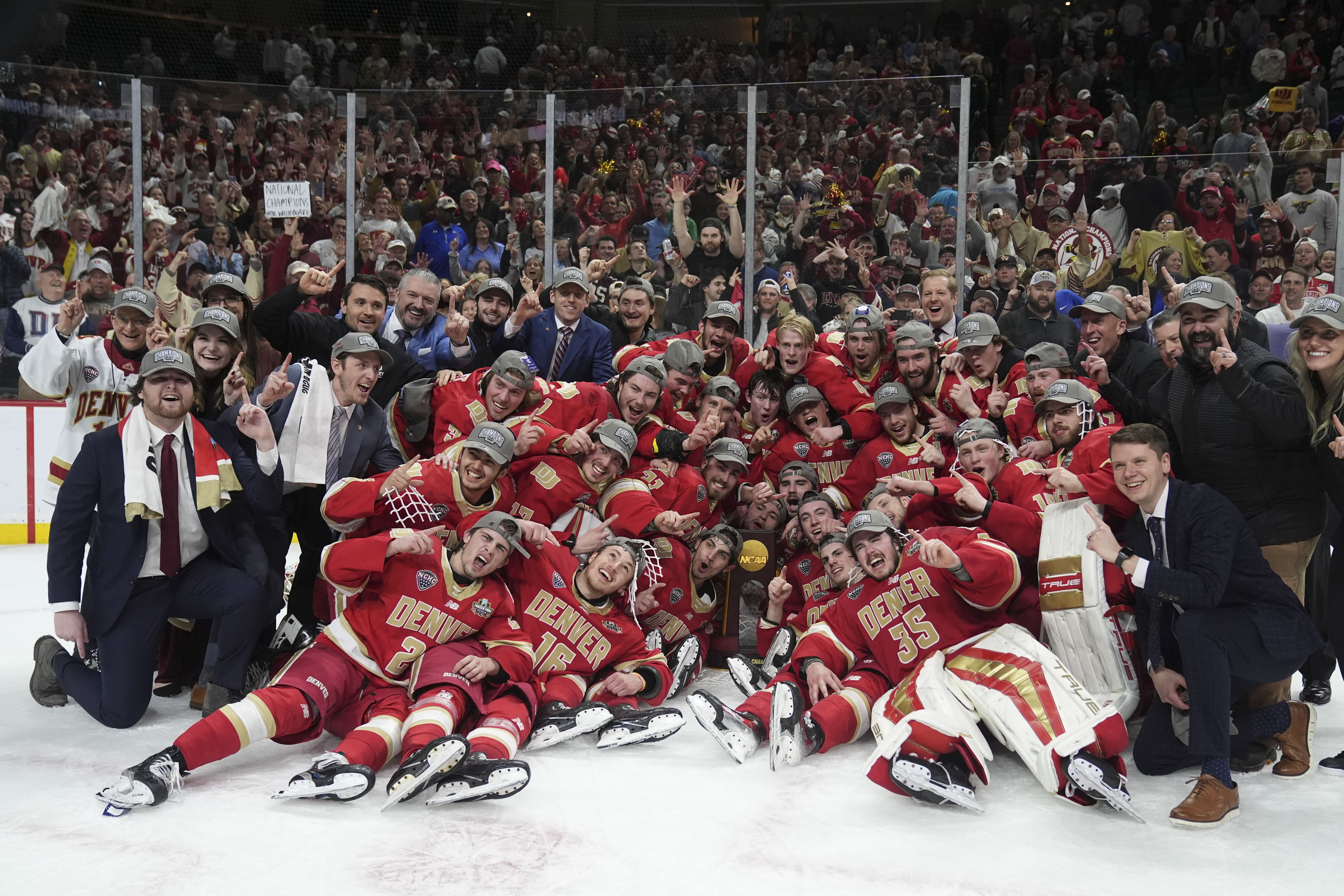 Denver poses with the championship trophy after defeating Boston College in the championship game of the Frozen Four NCAA college hockey tournament Saturday, April 13, 2024, in St. Paul, Minn. Denver won 2-0 to win the national championship. (AP Photo/Abbie Parr) (Abbie Parr)